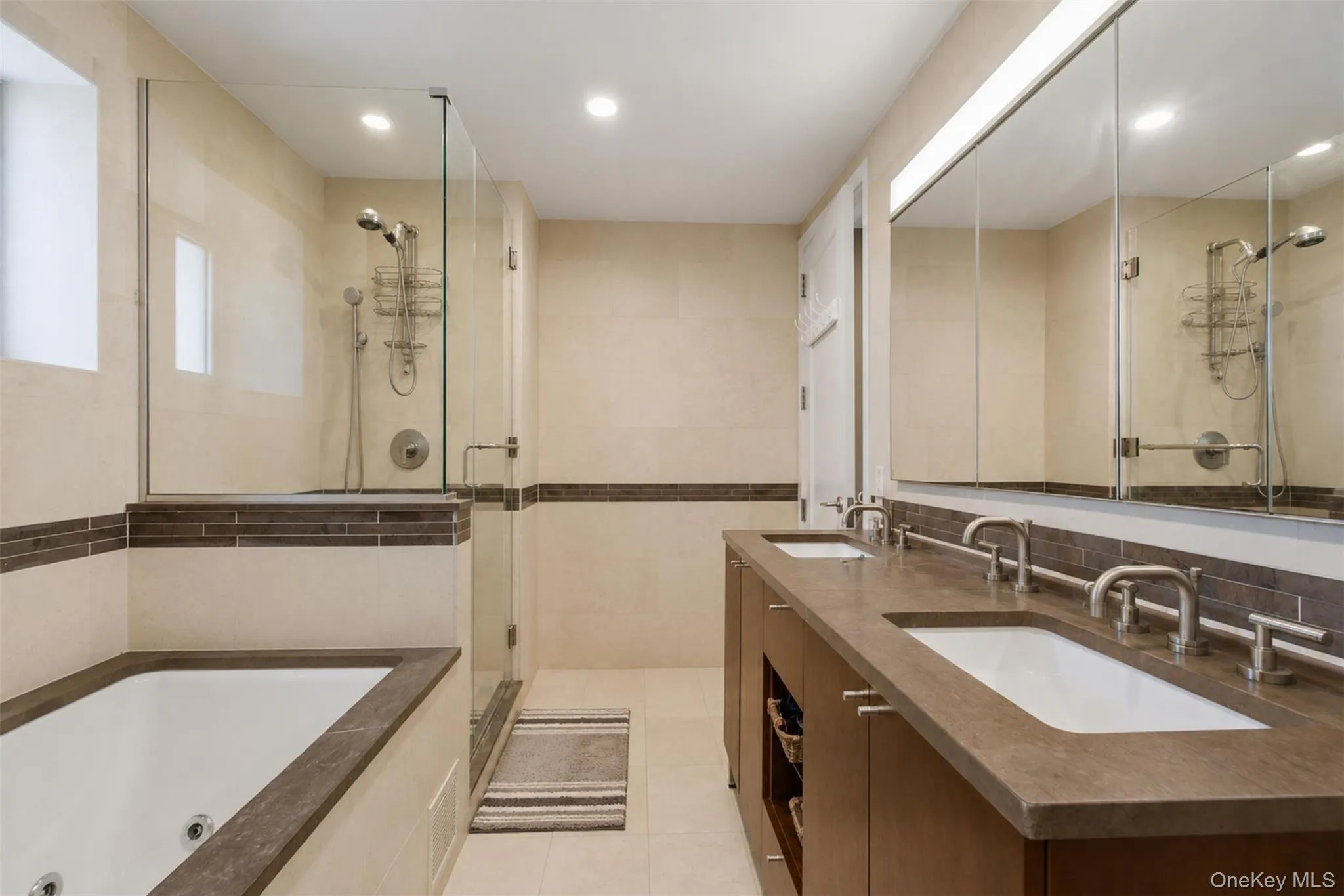 Dual vanity with individual sinks, integrated countertop, and wall-mounted faucets Dual vanity with individual sinks, integrated countertop, and wall-mounted faucets