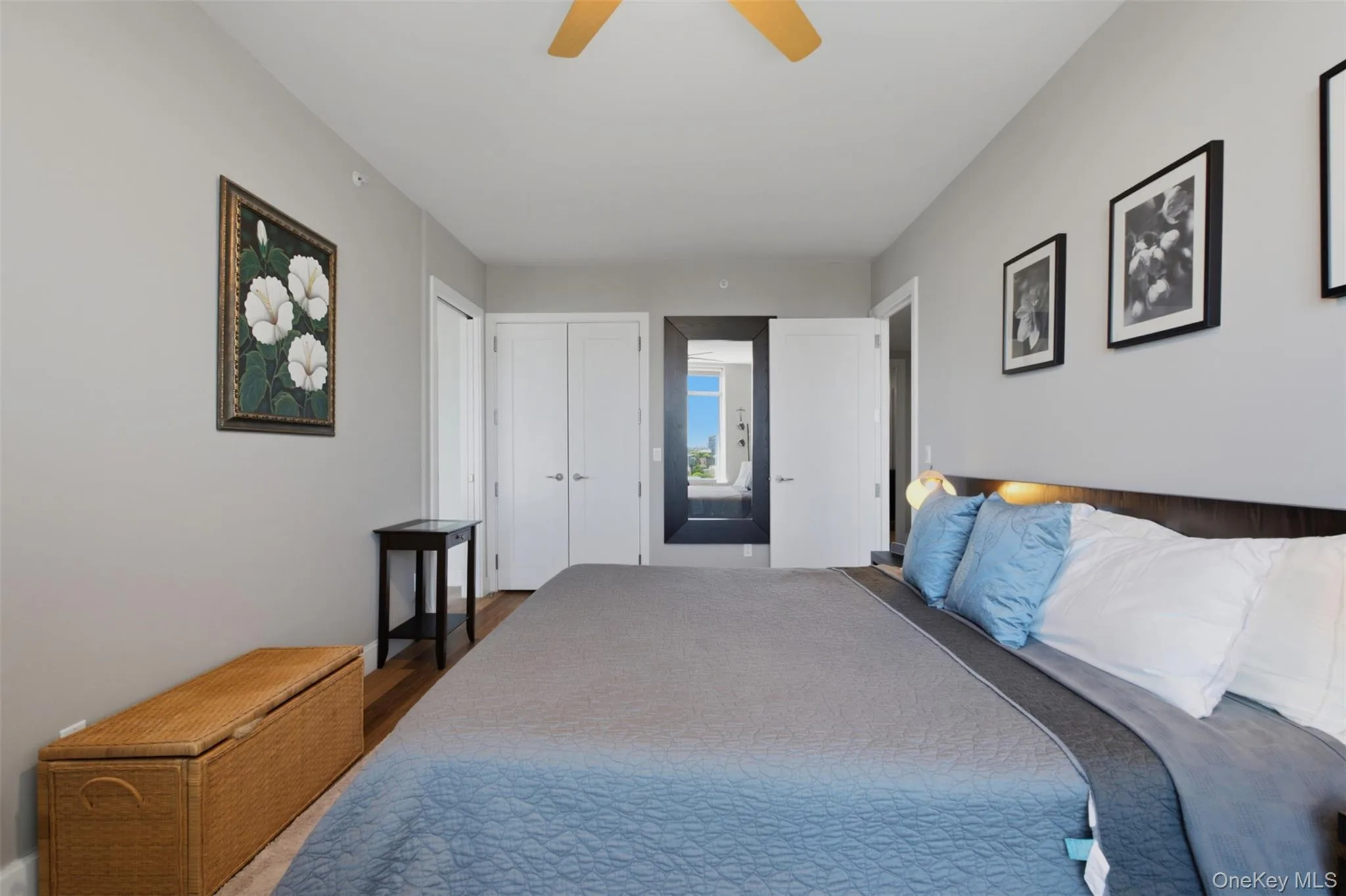 Bedroom 2 with light gray walls complement the wood-finish flooring in this room Bedroom 2 with light gray walls complement the wood-finish flooring in this room