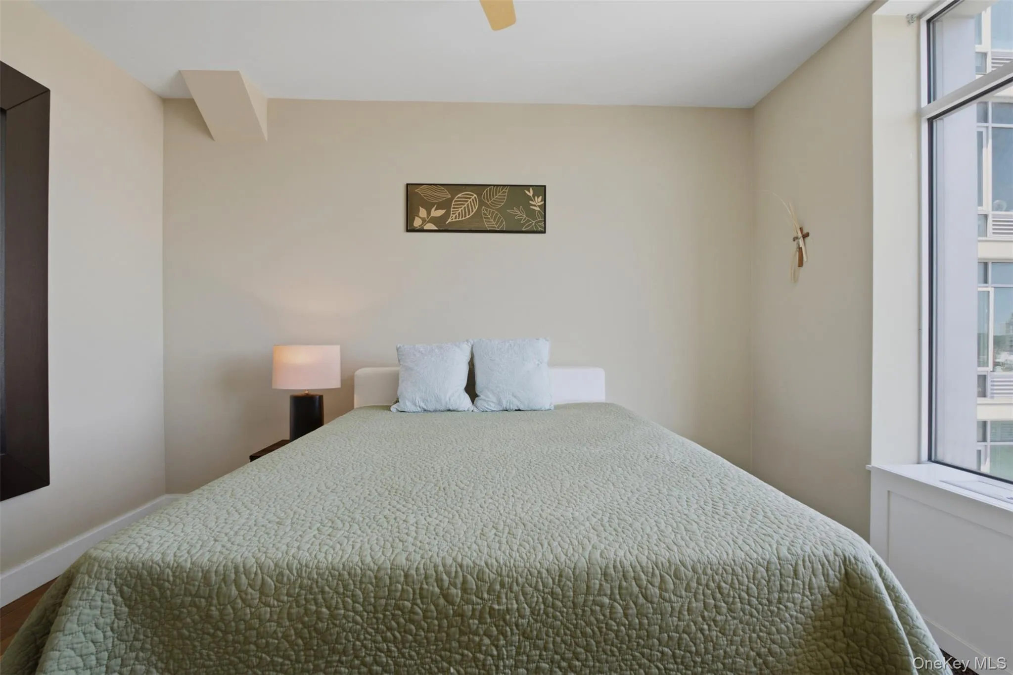 Bedroom 3 featuring an expansive window, a built-in window ledge, and light-toned walls Bedroom 3 featuring an expansive window, a built-in window ledge, and light-toned walls