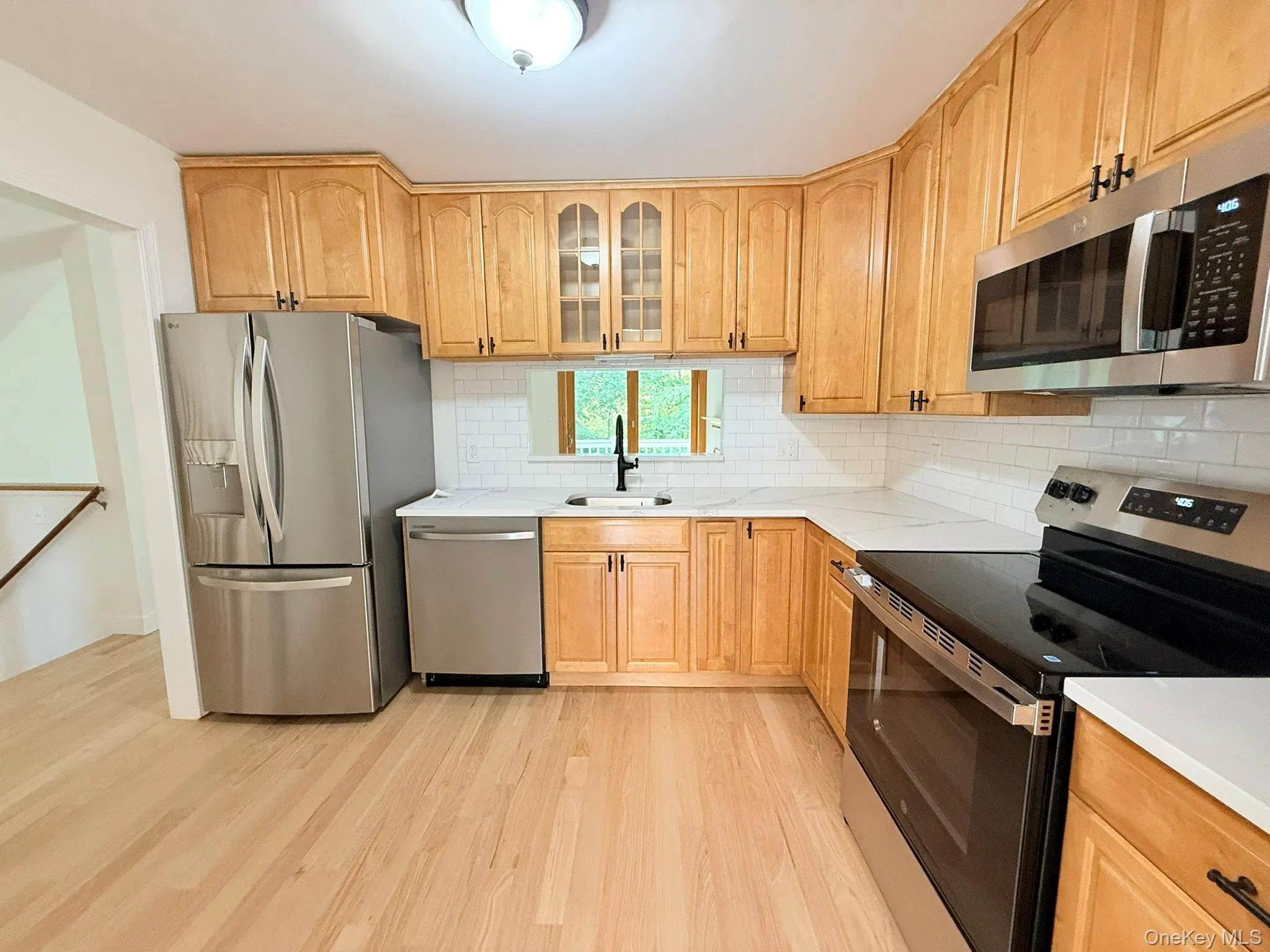 A bright, functional kitchen with stainless steel appliances, perfect for everyday cooking and entertaining. A bright, functional kitchen with stainless steel appliances, perfect for everyday cooking and entertaining.
