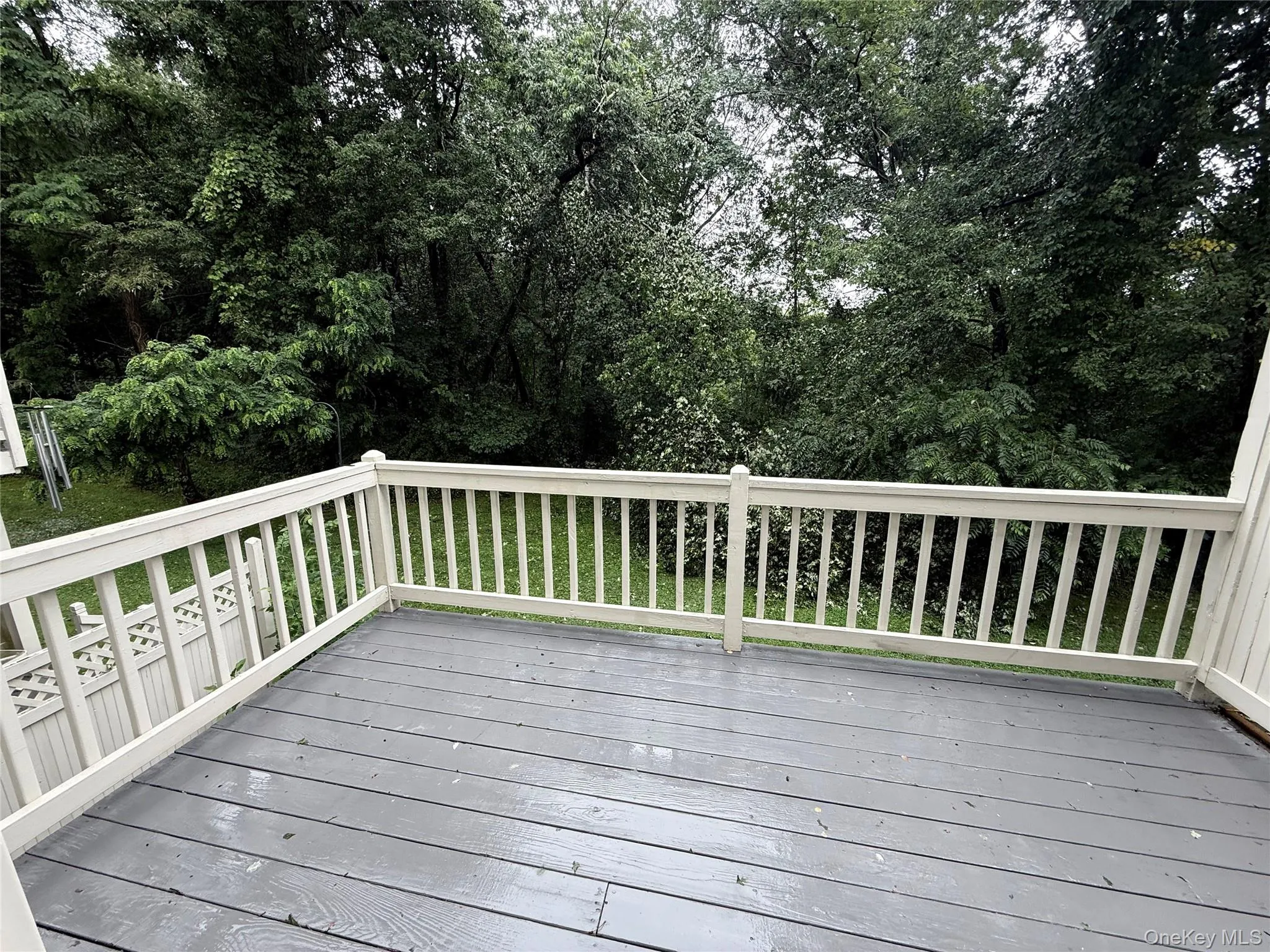 Step out onto the deck and enjoy peaceful views of the private wooded surroundings. Step out onto the deck and enjoy peaceful views of the private wooded surroundings.