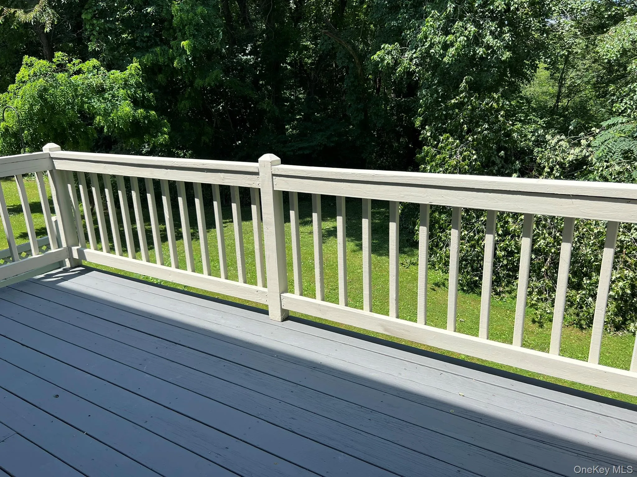 Enjoy outdoor living on the deck, surrounded by the privacy and beauty of the wooded backdrop. Enjoy outdoor living on the deck, surrounded by the privacy and beauty of the wooded backdrop.