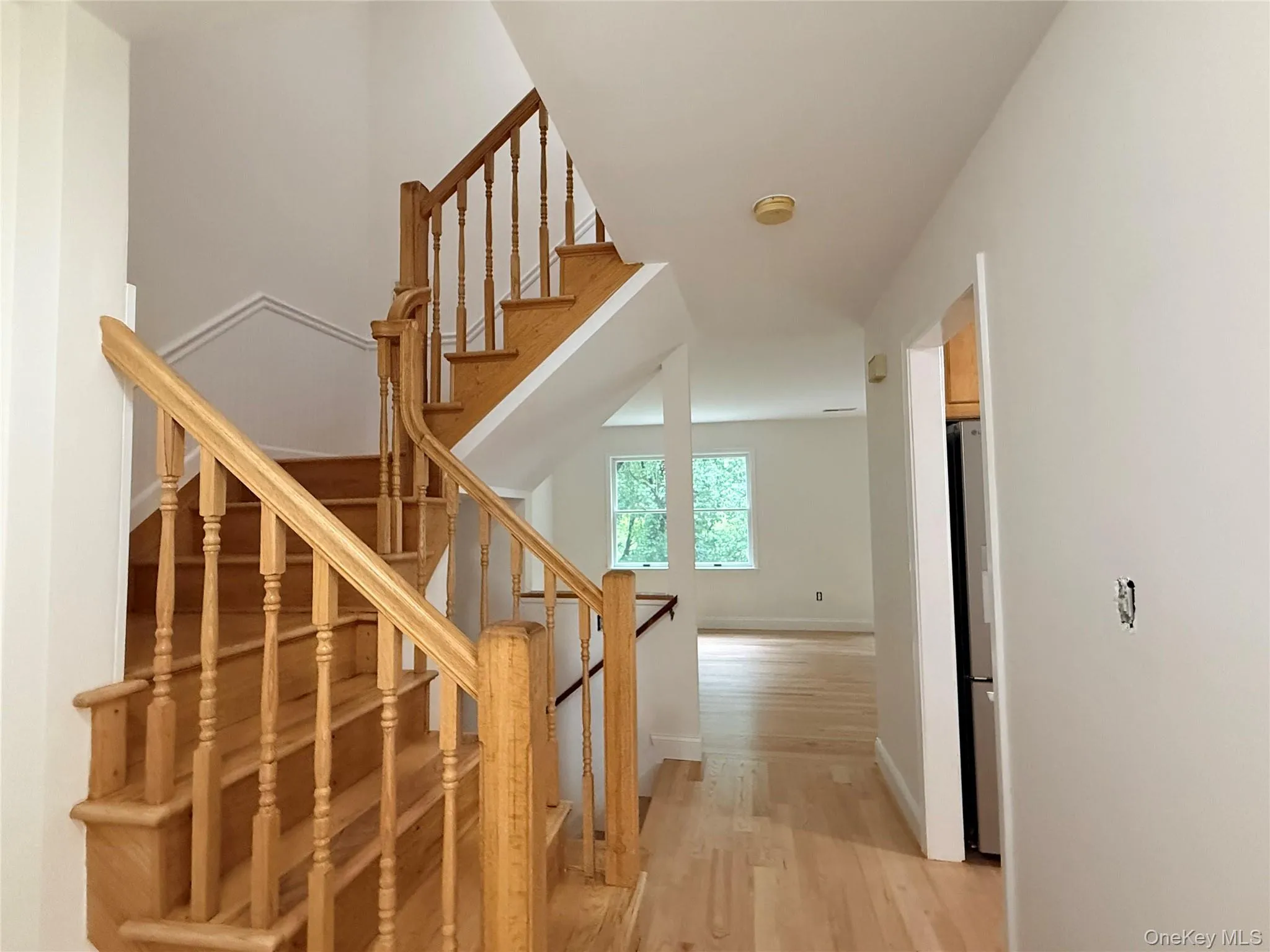 A bright entryway welcomes you in, with stairs leading to the home’s upper-level bedrooms. A bright entryway welcomes you in, with stairs leading to the home’s upper-level bedrooms.