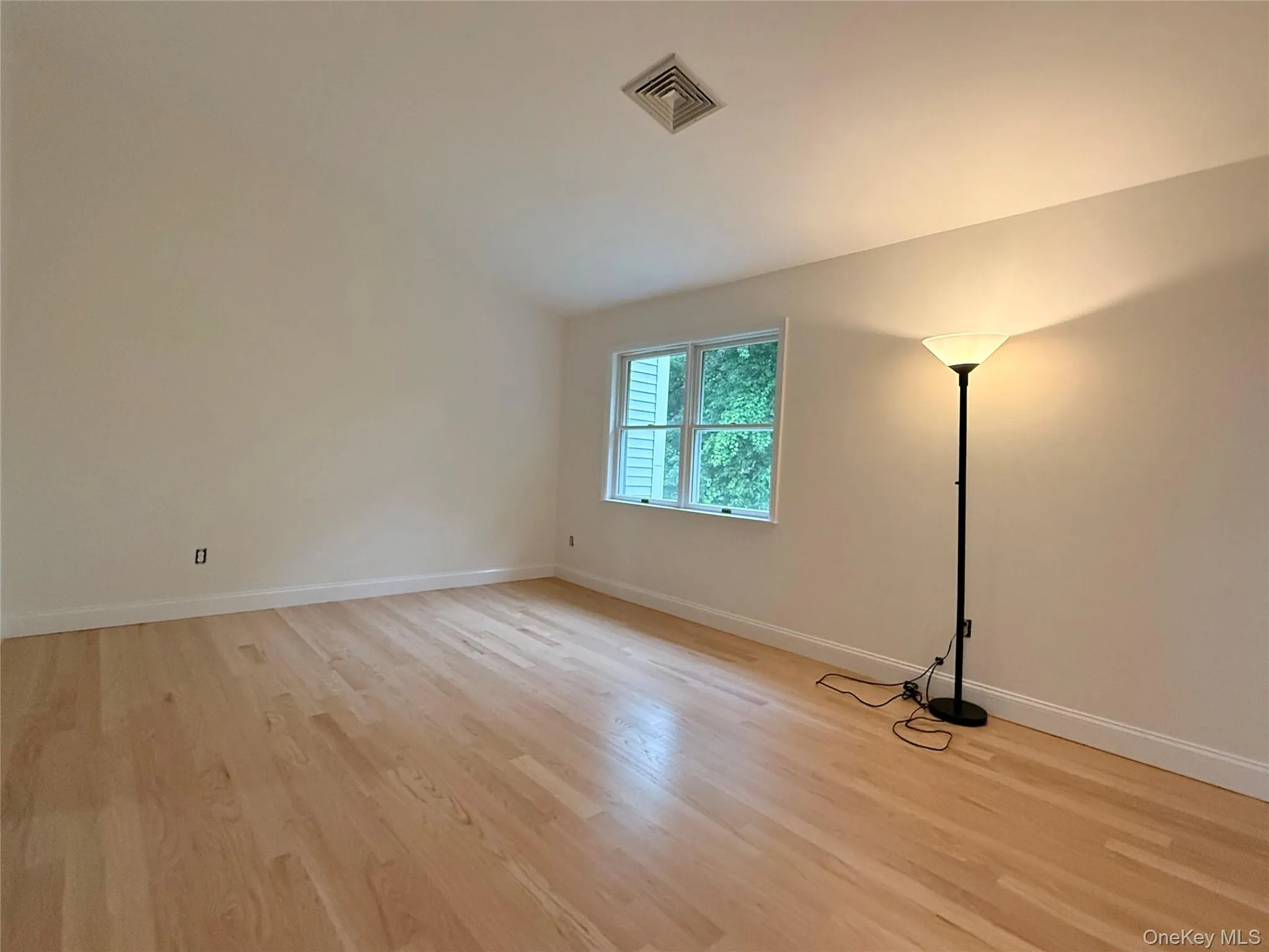 A spacious primary bedroom filled with natural light and a comfortable, inviting atmosphere. A spacious primary bedroom filled with natural light and a comfortable, inviting atmosphere.