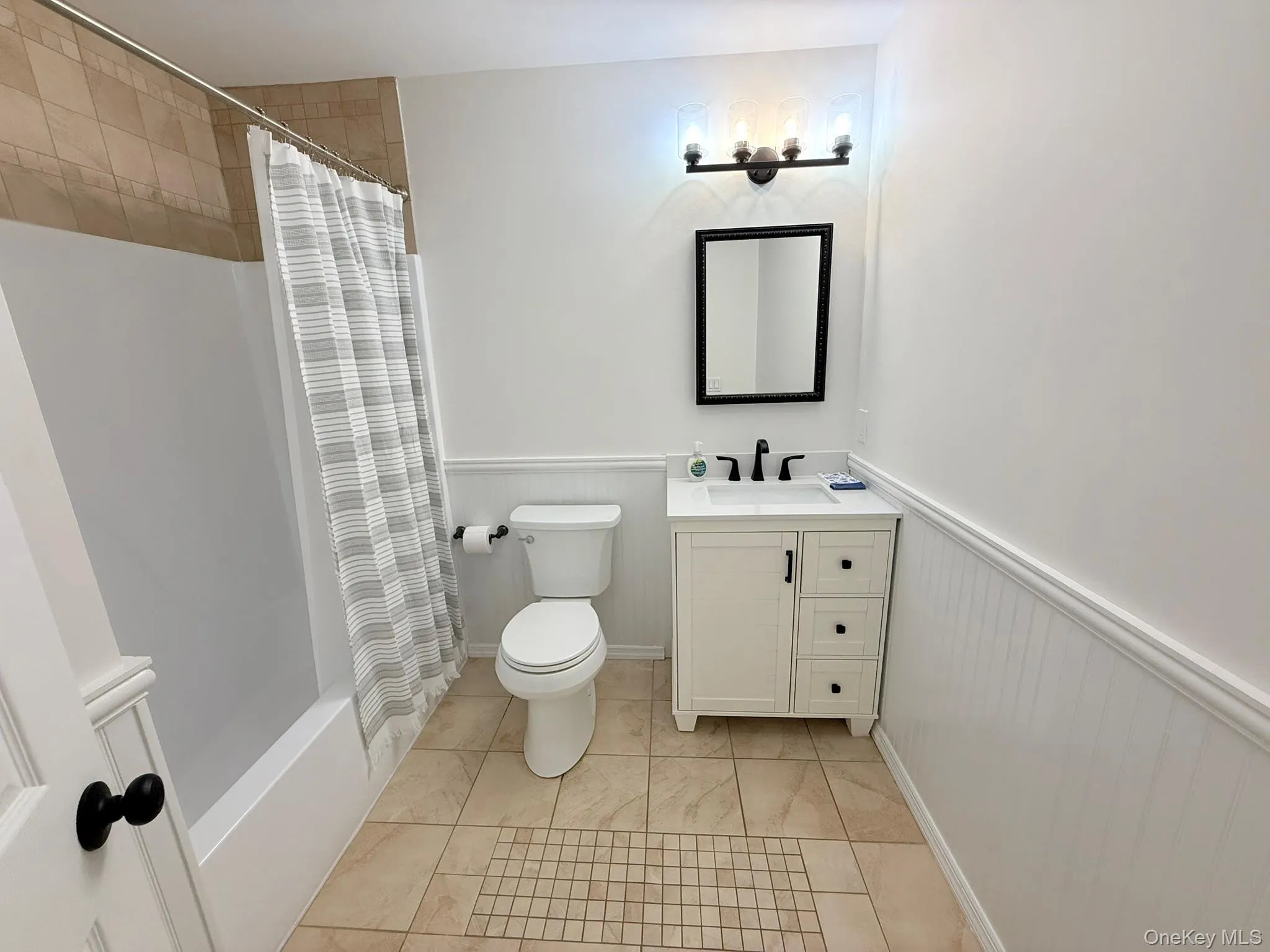 A beautifully bright full bathroom with fresh white finishes and a timeless, polished look A beautifully bright full bathroom with fresh white finishes and a timeless, polished look