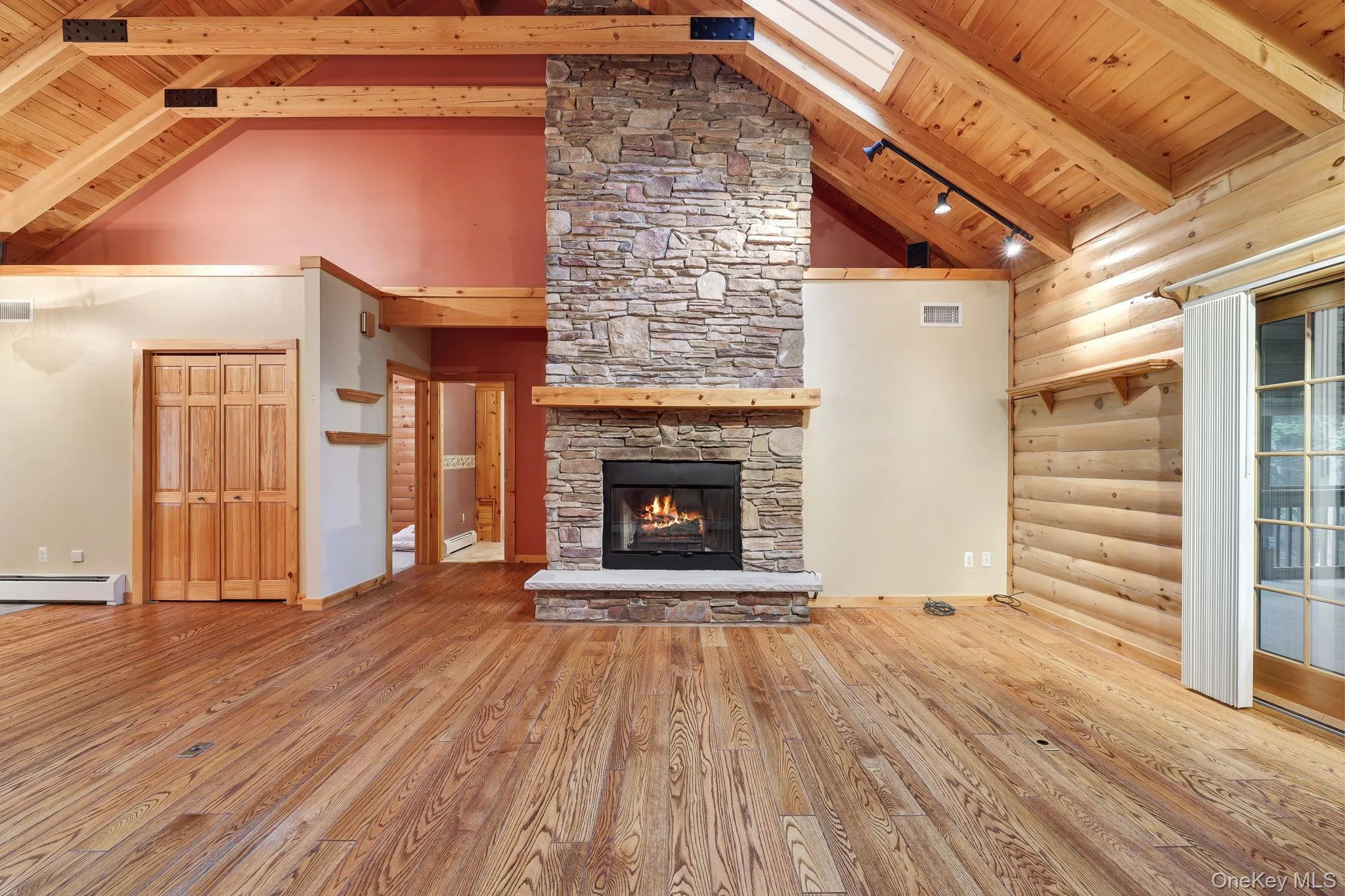 The living room has a stone fireplace. The living room has a stone fireplace.