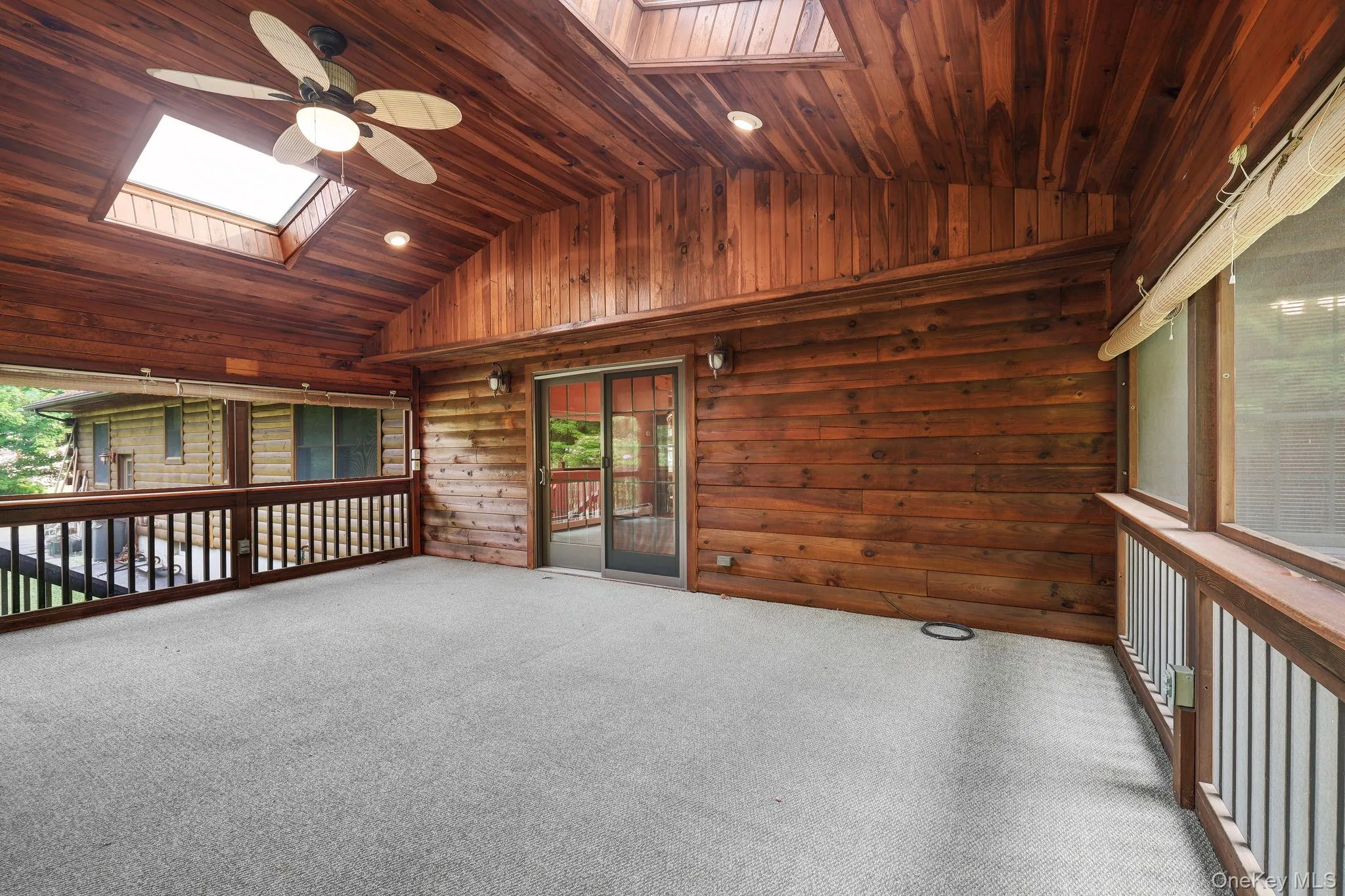 There are skylights in the screened porch and sliding doors into the living room. There are skylights in the screened porch and sliding doors into the living room.
