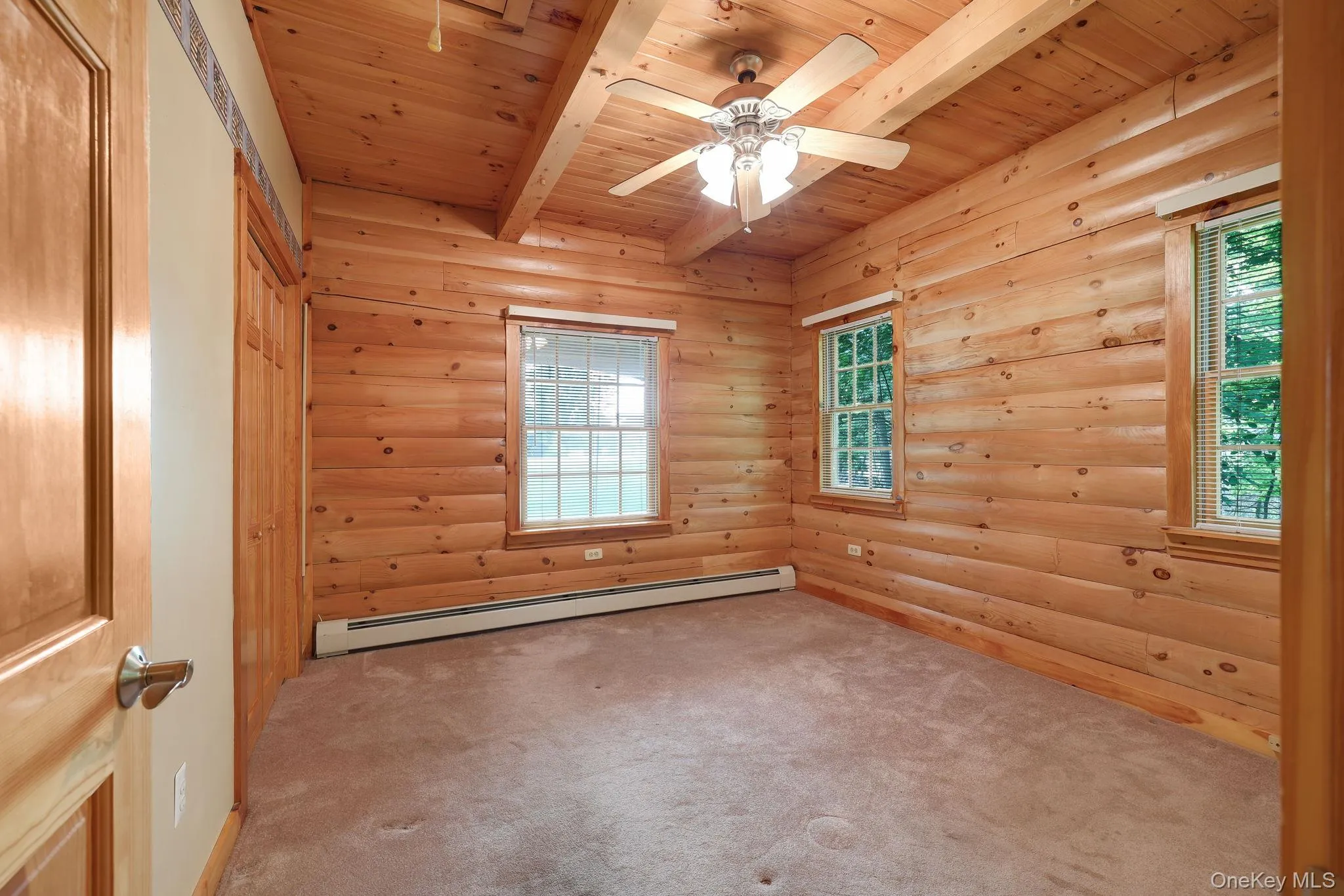 Spacious bedroom with a good size closet and three windows. Spacious bedroom with a good size closet and three windows.