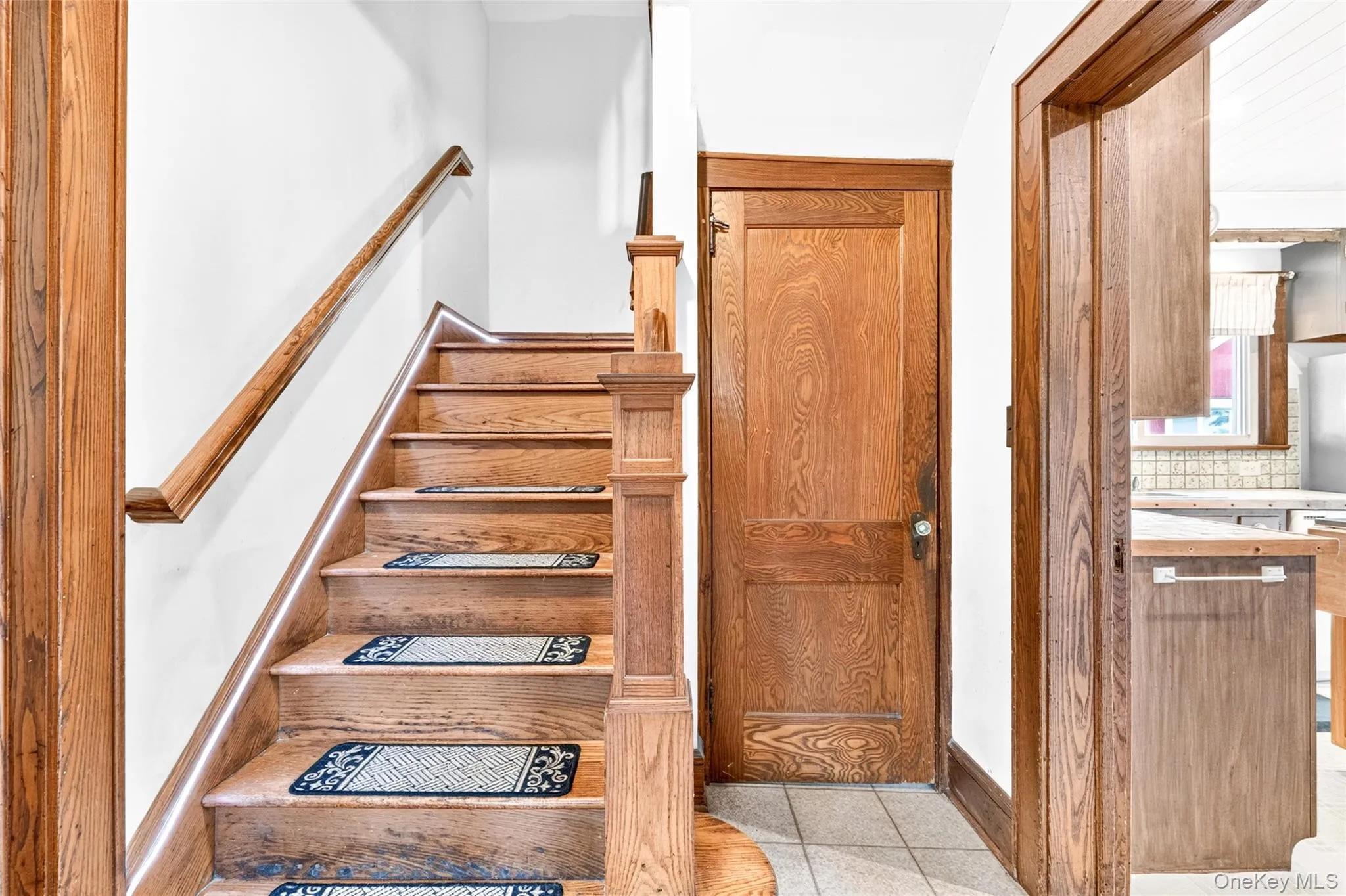 Staircase with wood treads and handrail, featuring integrated lighting Staircase with wood treads and handrail, featuring integrated lighting