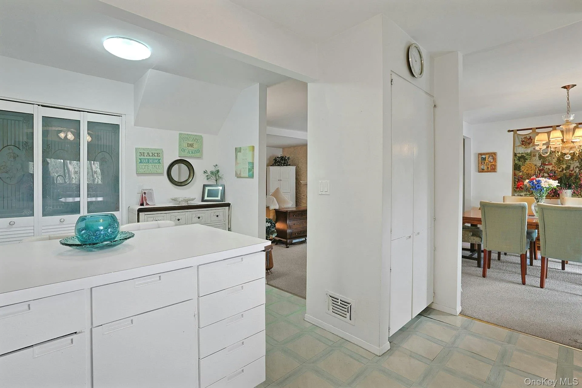 The closet underneath the clock is a very generous size pantry area. All of your supplies can be neatly packed away. The closet underneath the clock is a very generous size pantry area. All of your supplies can be neatly packed away.