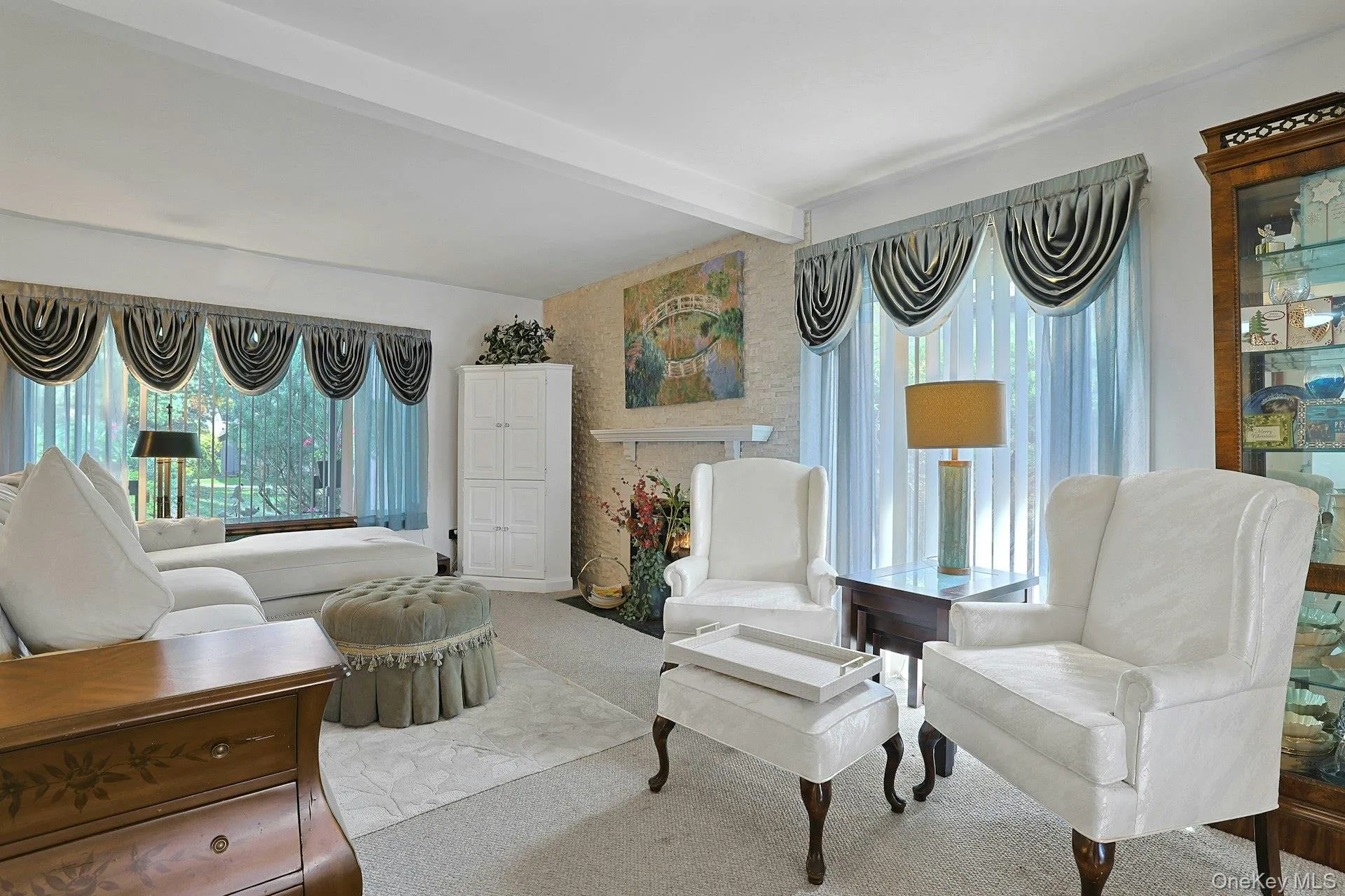 The Living room offers an abundance of sunlight, and a beautiful fireplace as well. The Living room offers an abundance of sunlight, and a beautiful fireplace as well.