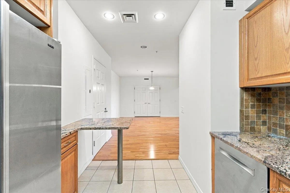 Stainless steel refrigerator and dishwasher with granite countertops Stainless steel refrigerator and dishwasher with granite countertops
