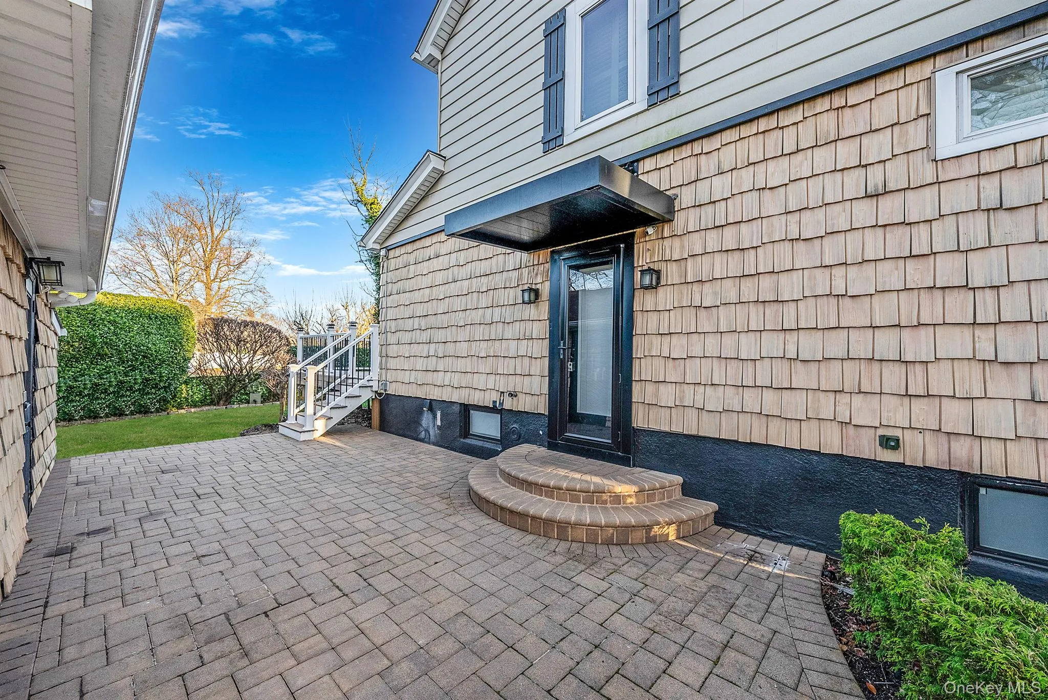 Property entrance featuring a patio area Property entrance featuring a patio area