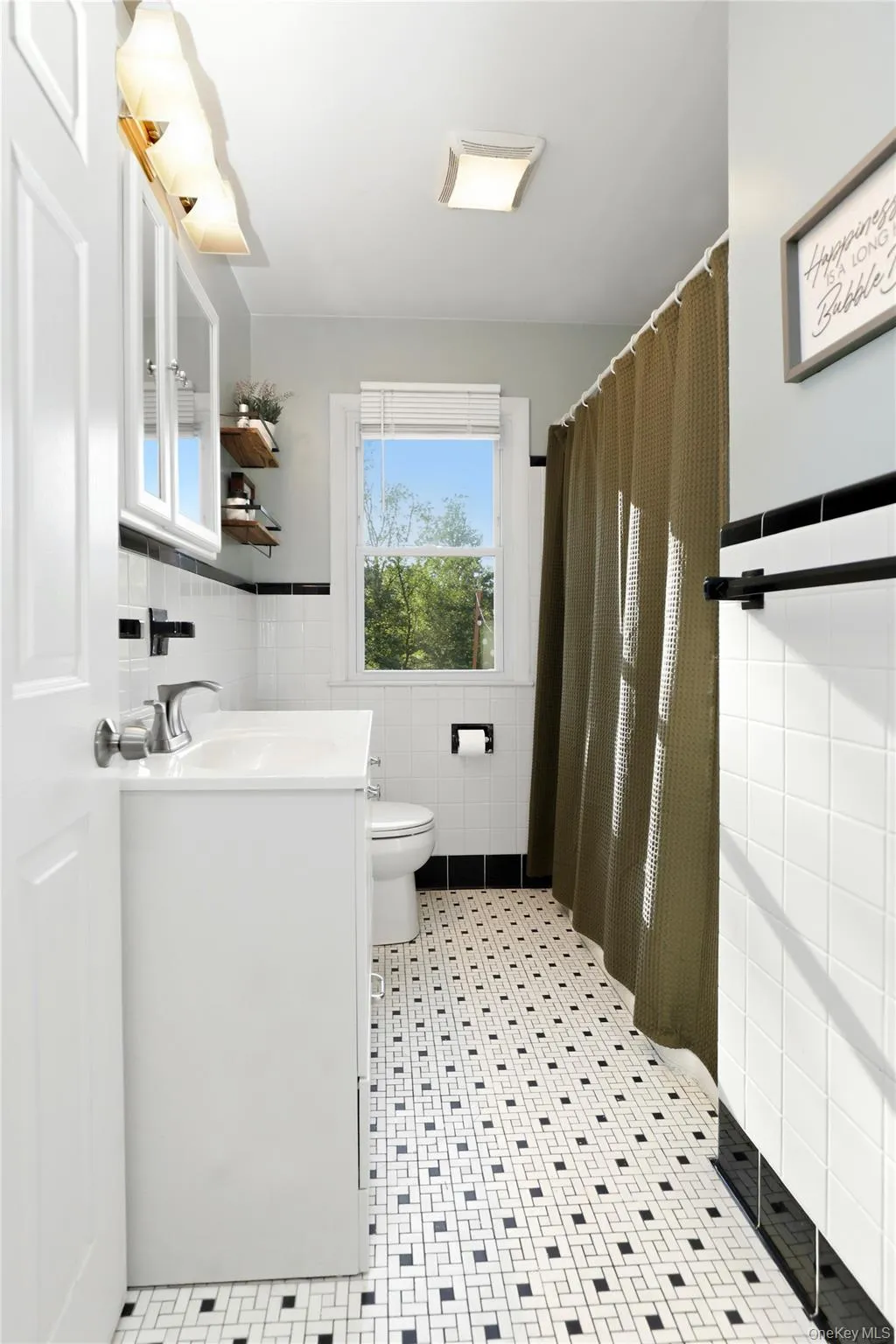 Bathroom with tub/shower combo. Bathroom with tub/shower combo.