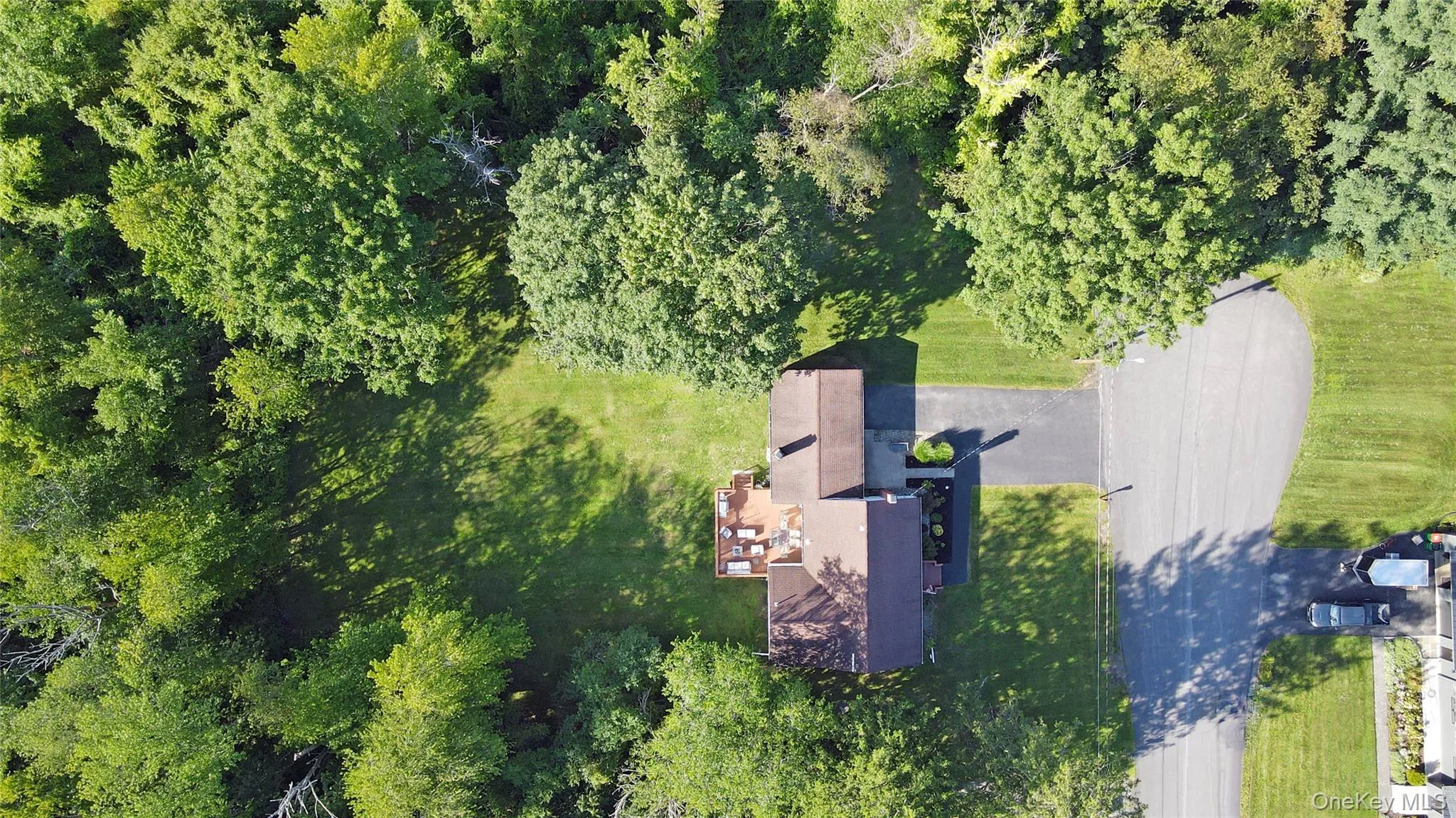 Treelined property with views of meadow beyond. Treelined property with views of meadow beyond.