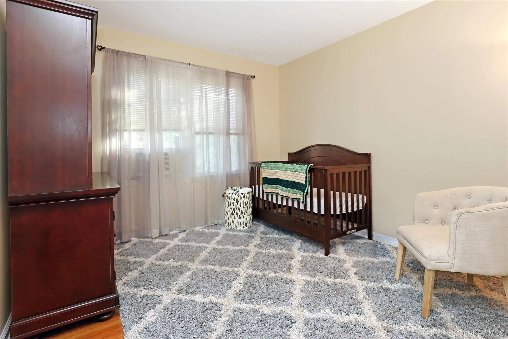 Bedroom with deep single closet & hardwood floors. Bedroom with deep single closet & hardwood floors.