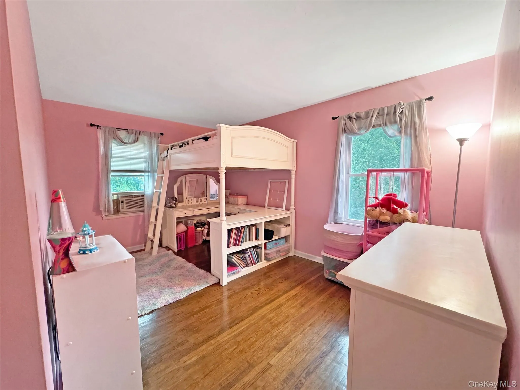 Bedroom with deep single closet & hardwood floors. Bedroom with deep single closet & hardwood floors.