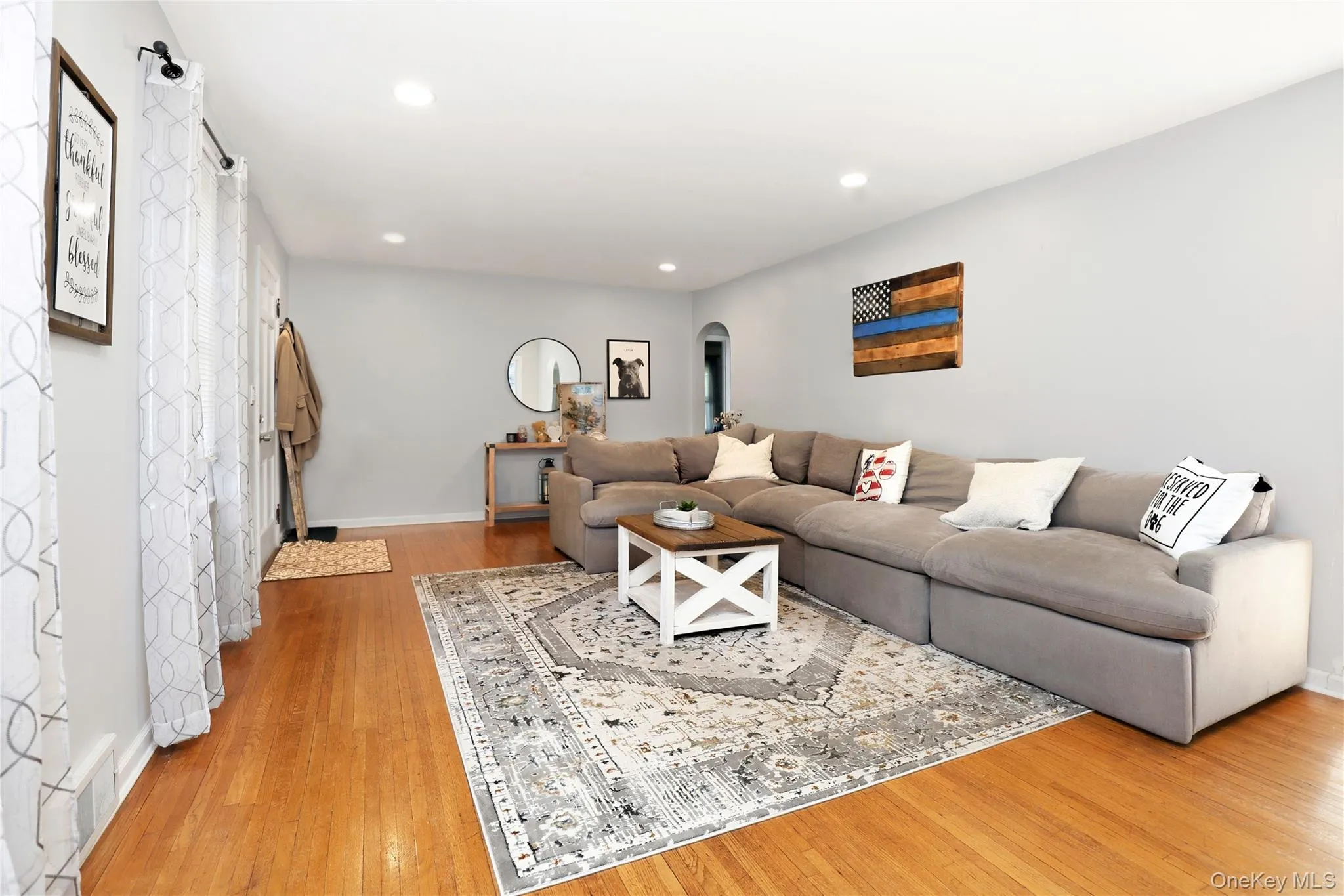 Spacious LR with hardwood floors and lots of windows. Spacious LR with hardwood floors and lots of windows.