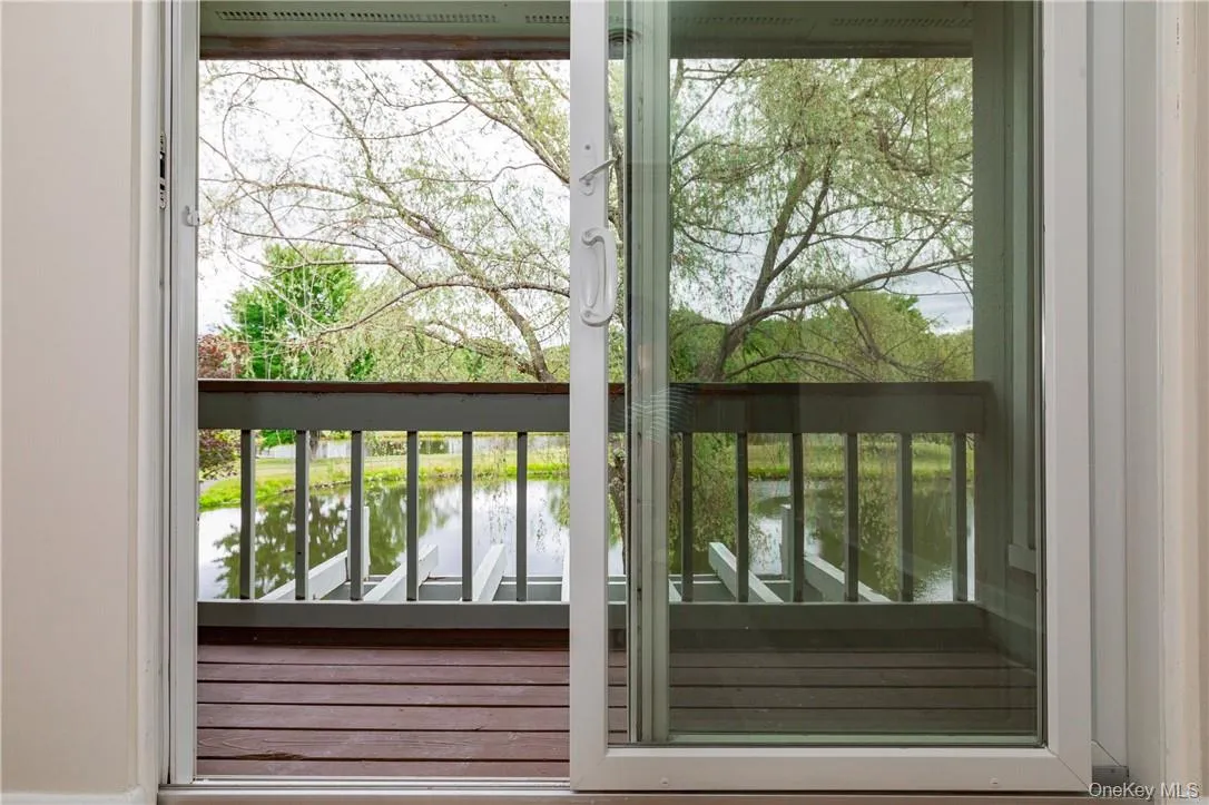 Deck off the Dining Area overlooking the Pond Deck off the Dining Area overlooking the Pond