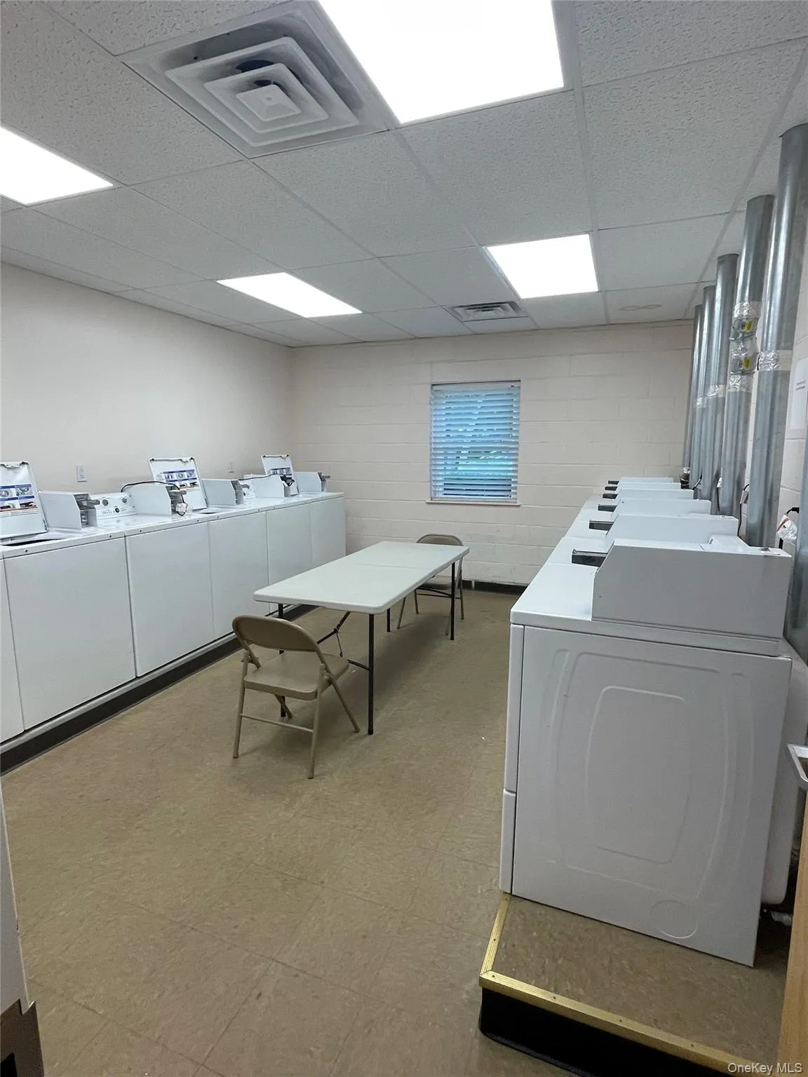 Dedicated laundry facility featuring multiple washers and dryers Dedicated laundry facility featuring multiple washers and dryers