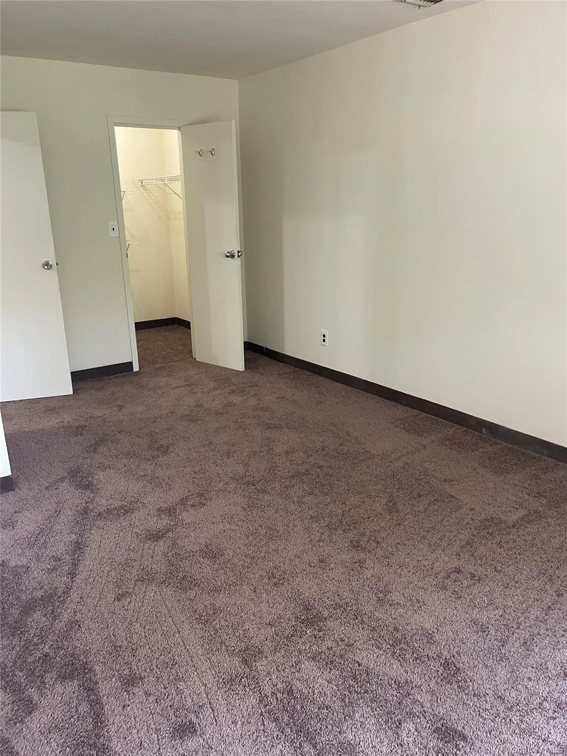 Room featuring neutral-toned walls, new carpeting Room featuring neutral-toned walls, new carpeting
