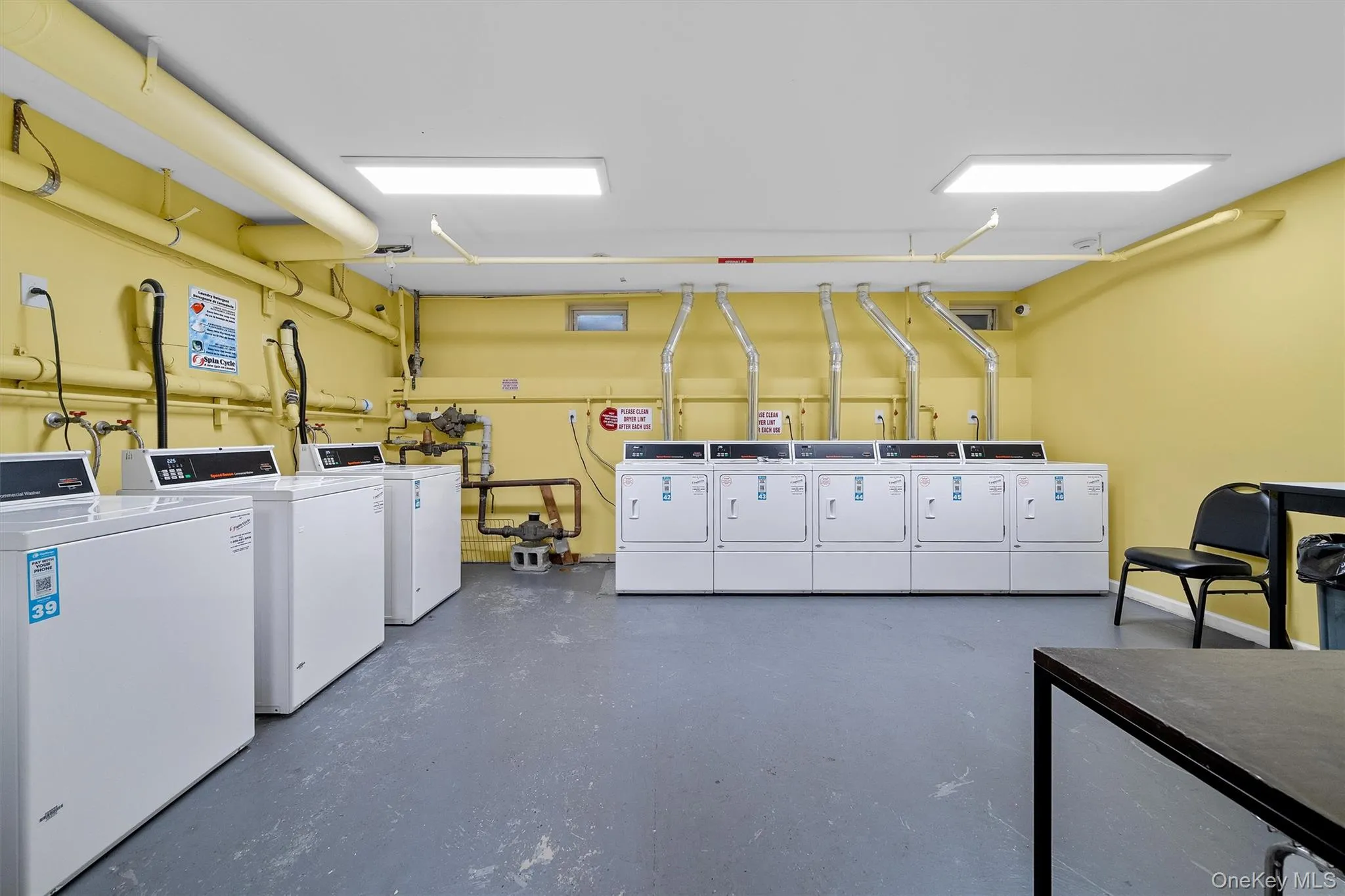 Shared laundry area featuring independent washer and dryer Shared laundry area featuring independent washer and dryer