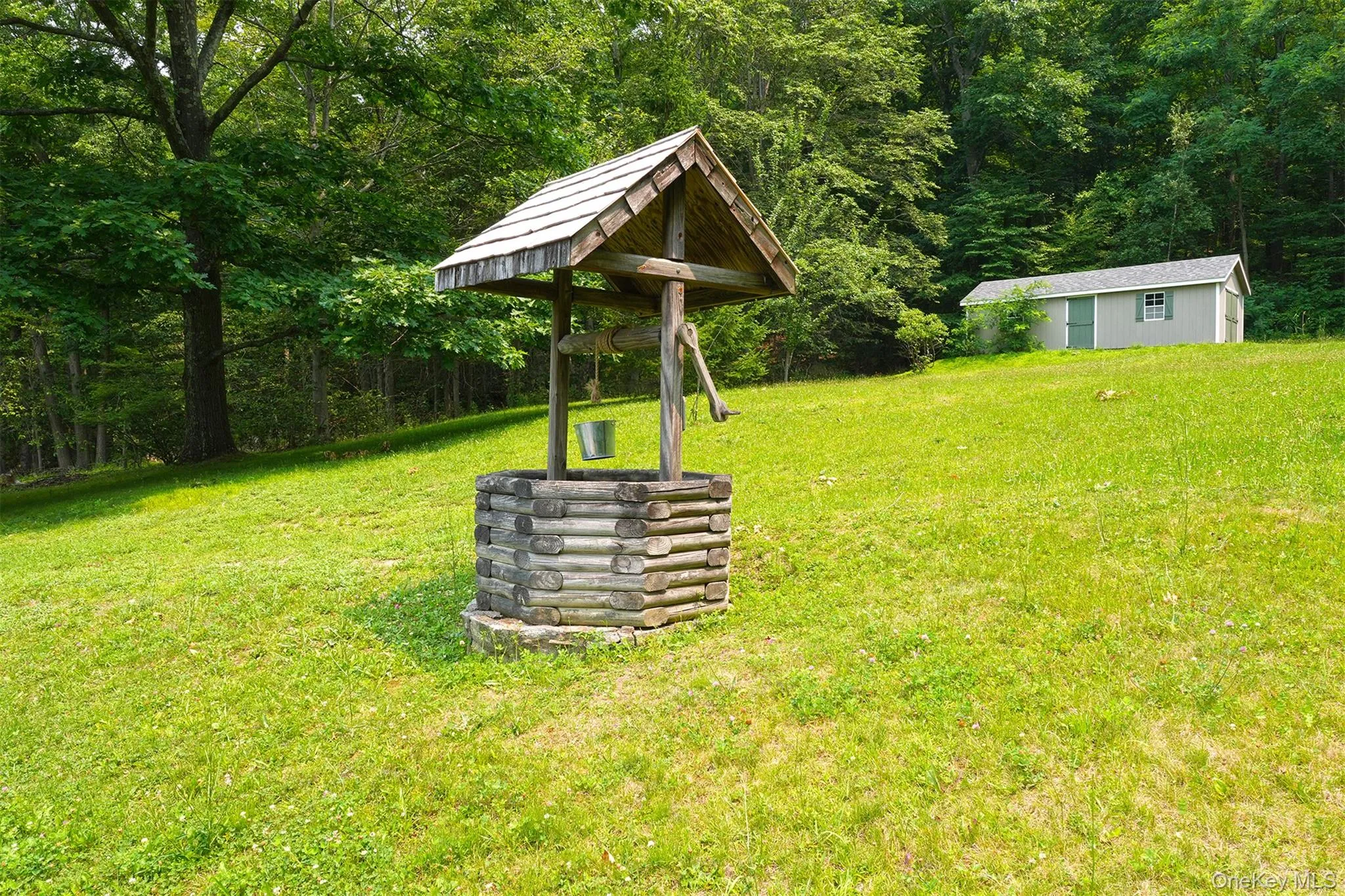 One of two sheds for storage plus a decorative well. One of two sheds for storage plus a decorative well.