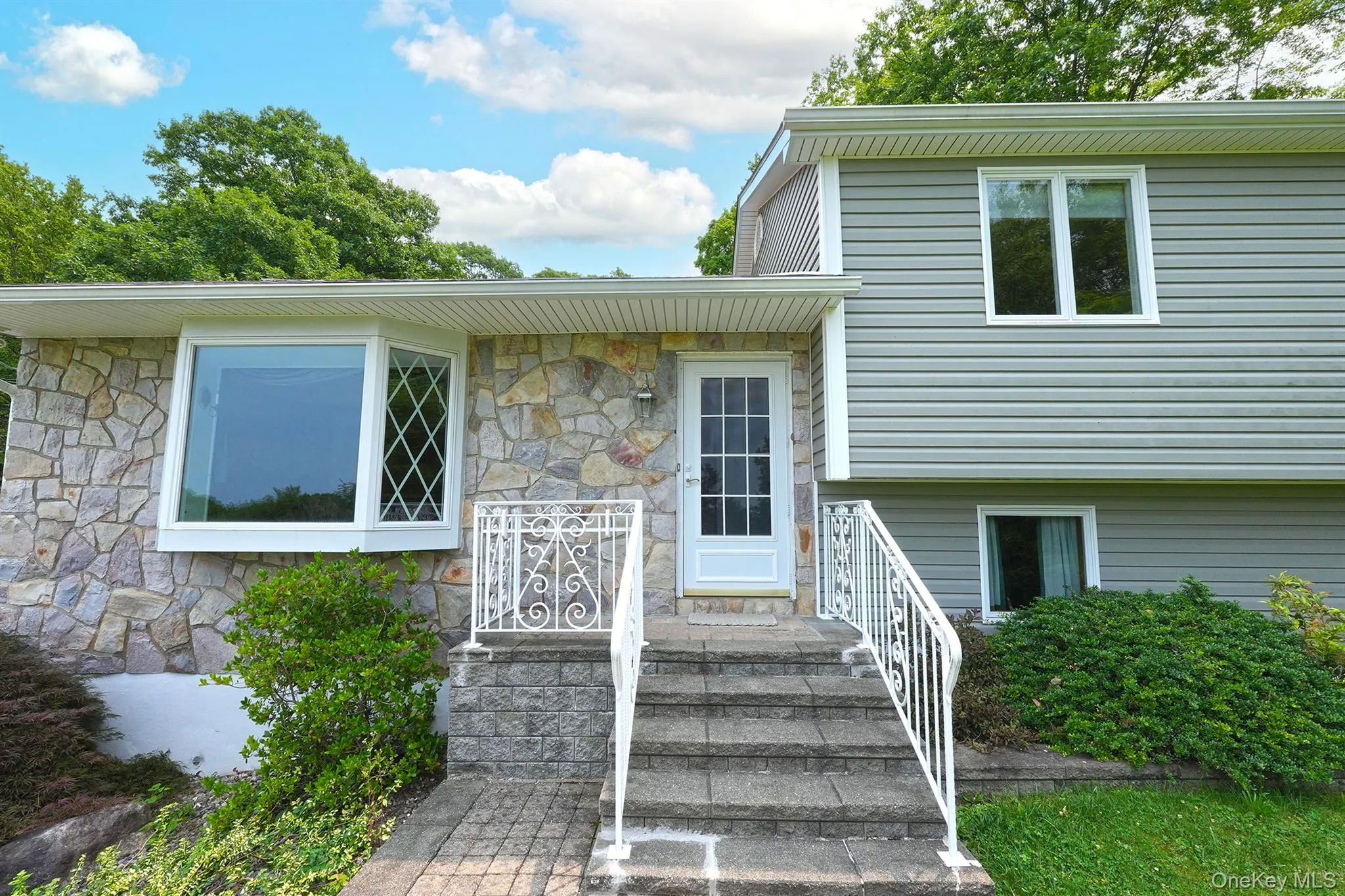 Close-up of Stone front and Angle Bay Window. Close-up of Stone front and Angle Bay Window.
