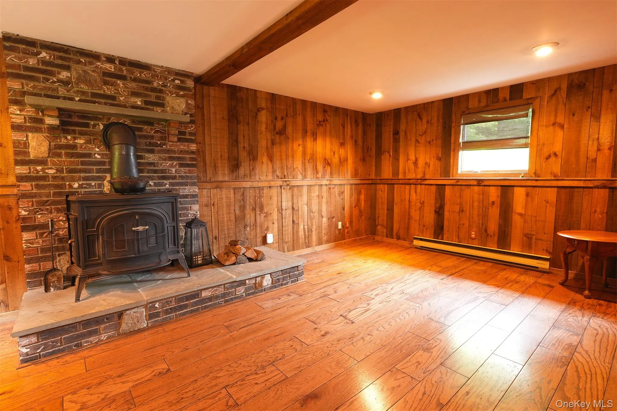 Large Family Room with raised hearth and wood stove. Large Family Room with raised hearth and wood stove.