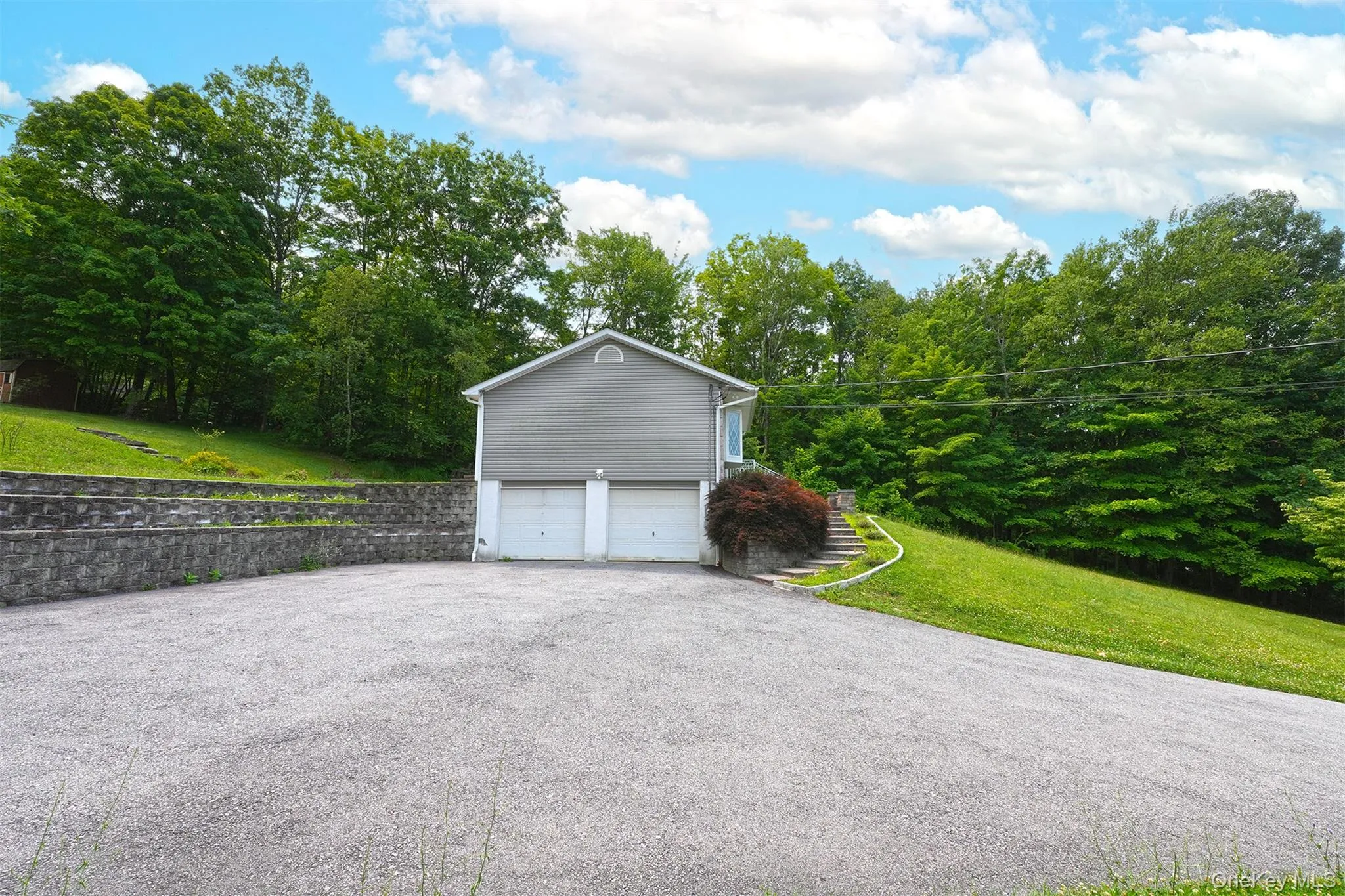 Large 2 car garage with plenty of room for 4-5 cars in driveway. Large 2 car garage with plenty of room for 4-5 cars in driveway.