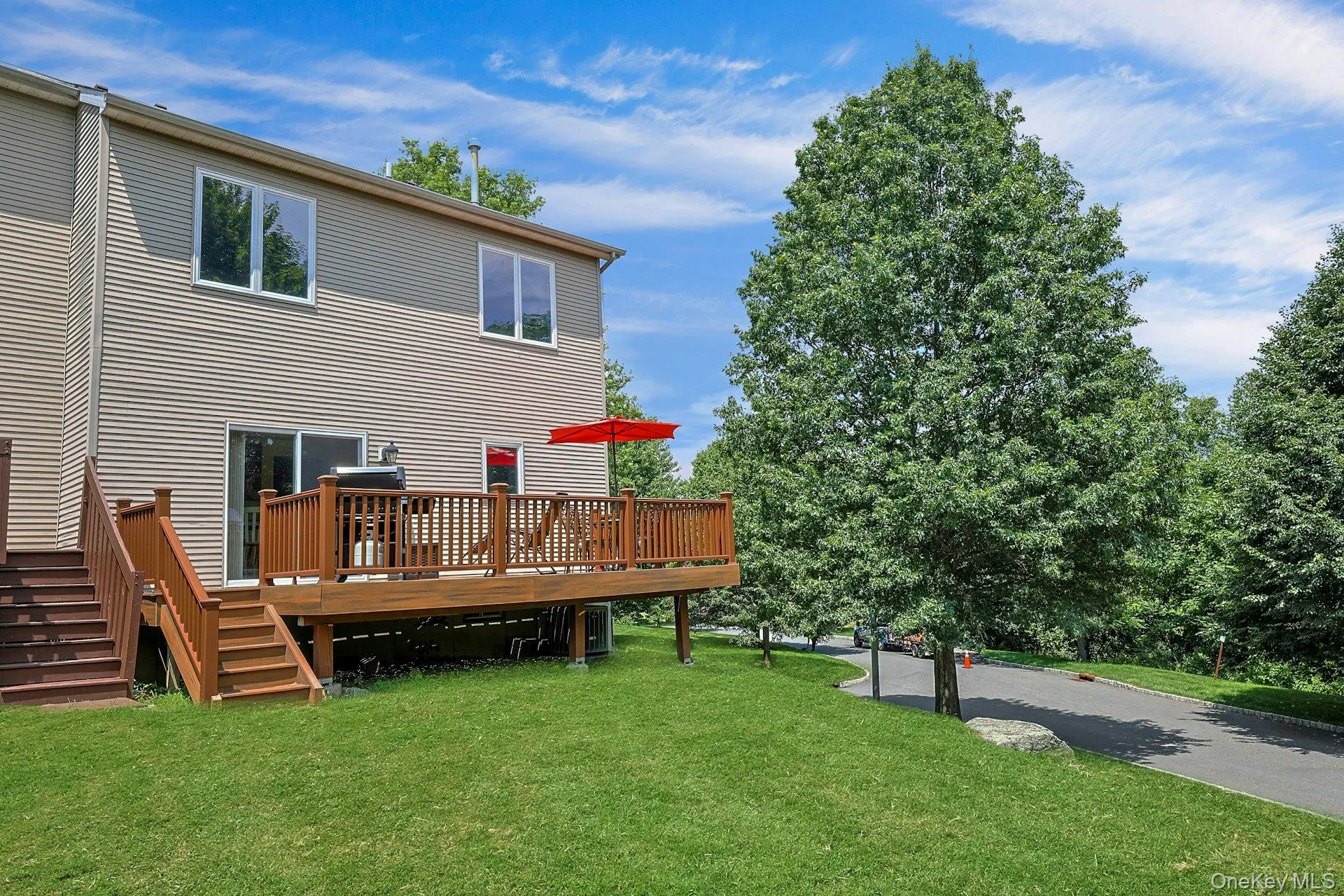 Enjoy the added privacy of an end unit with a large deck and expansive open space all around. Enjoy the added privacy of an end unit with a large deck and expansive open space all around.