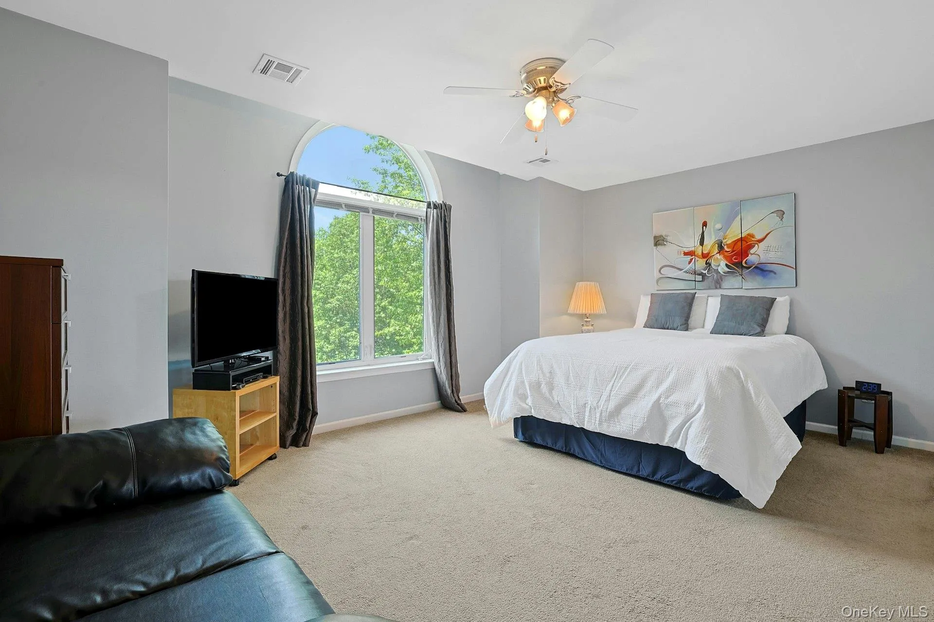 A bright primary bedroom with generous natural light and plenty of room to relax. A bright primary bedroom with generous natural light and plenty of room to relax.