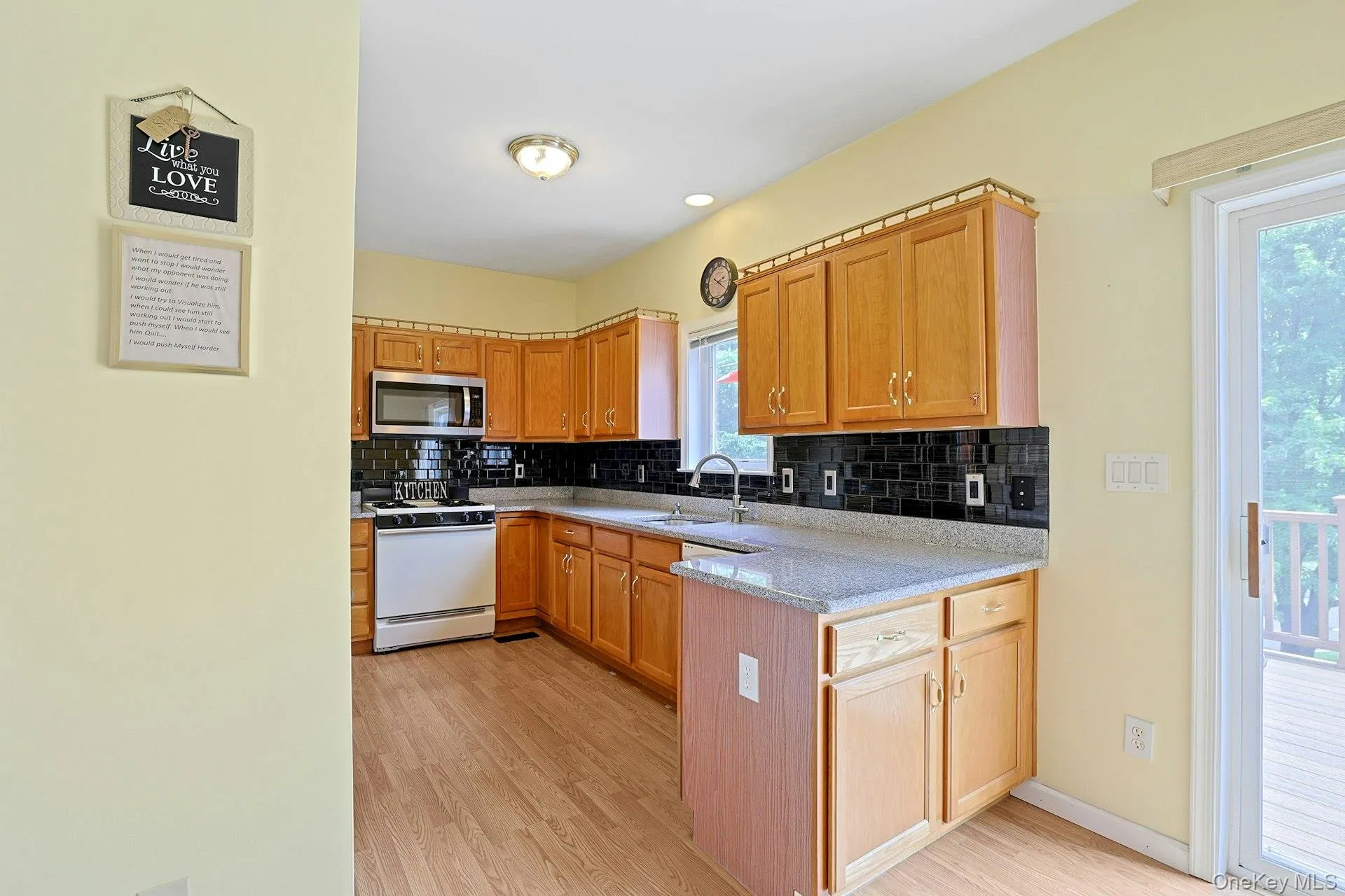 The kitchen features plenty of cabinet space and room for everyday essentials. The kitchen features plenty of cabinet space and room for everyday essentials.