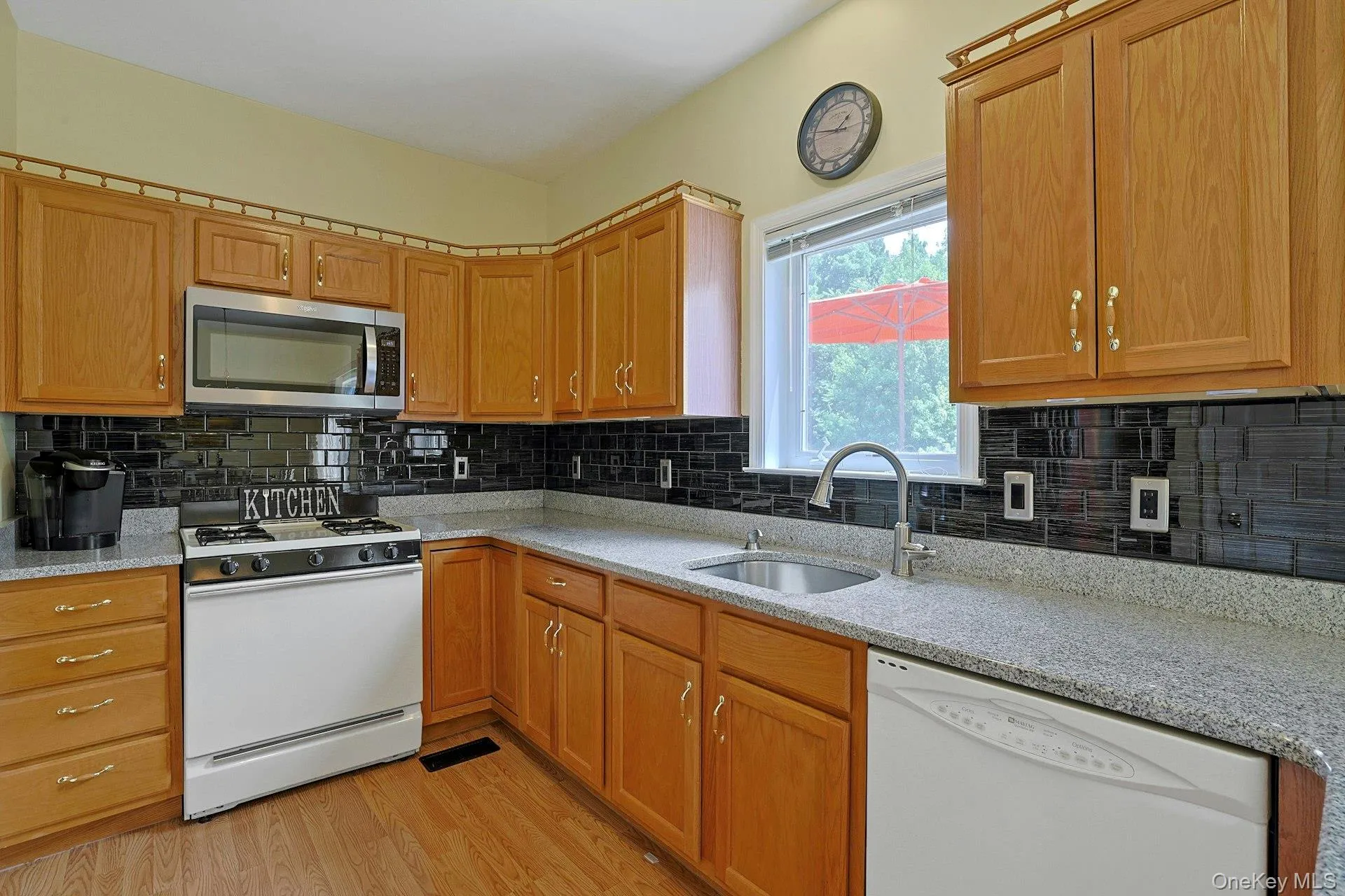 Bright and functional kitchen with a window overlooking the outdoors. Bright and functional kitchen with a window overlooking the outdoors.