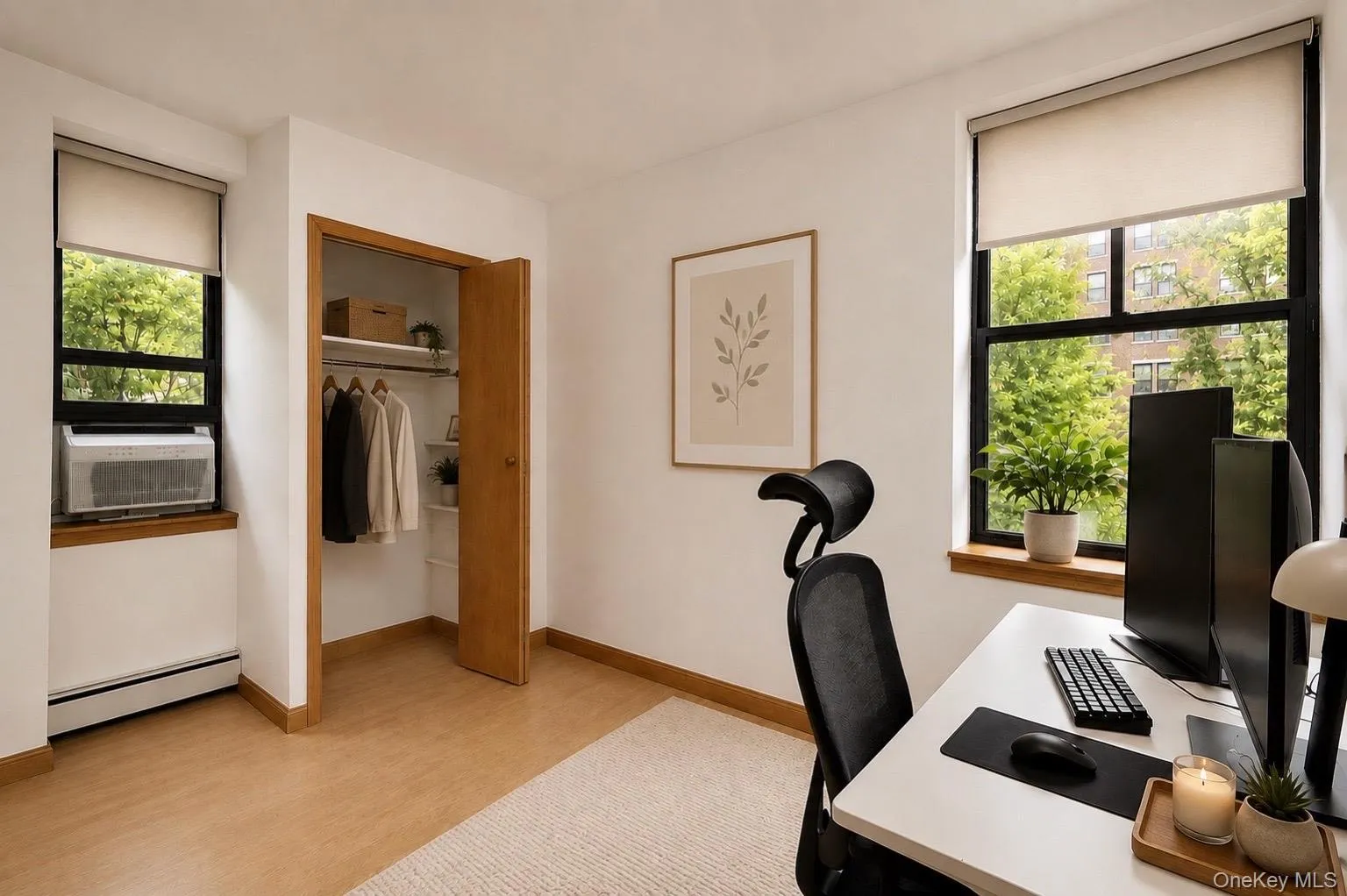 Built-in closet with shelving, and large windows with roller shades. Built-in closet with shelving, and large windows with roller shades.