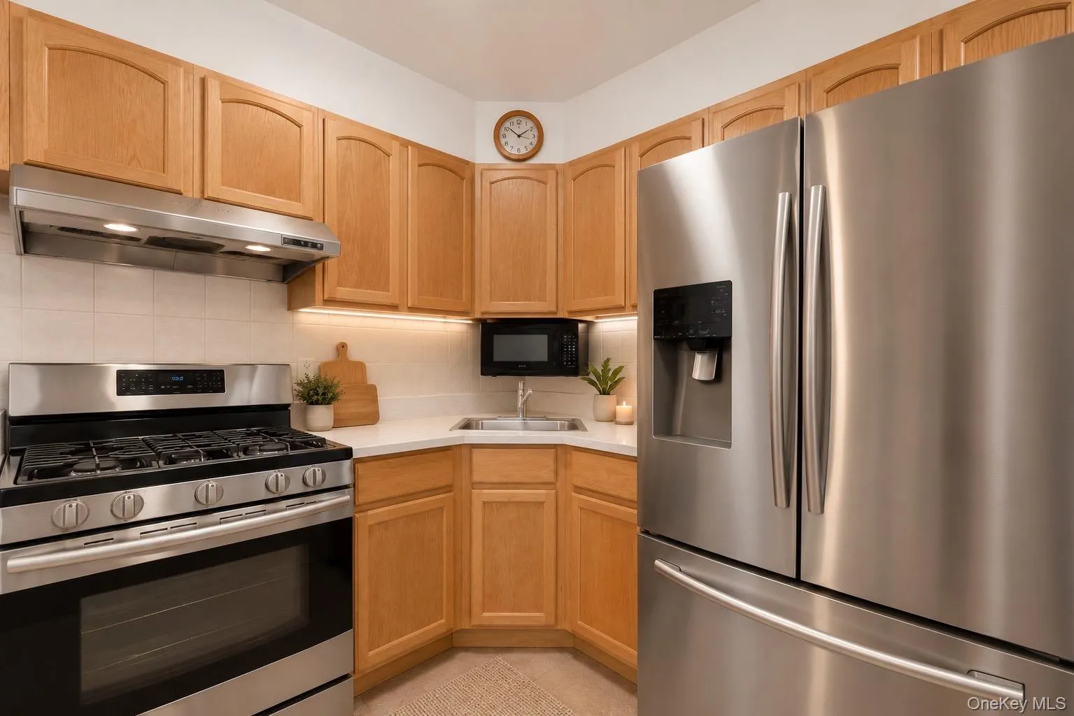 Stainless steel appliances, wood-finish cabinetry. Stainless steel appliances, wood-finish cabinetry.