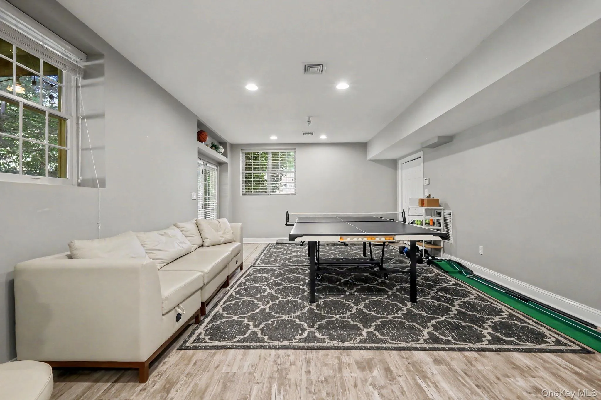 versatile recreation space, multiple windows, sliders out to lower level patio and yard. versatile recreation space, multiple windows, sliders out to lower level patio and yard.