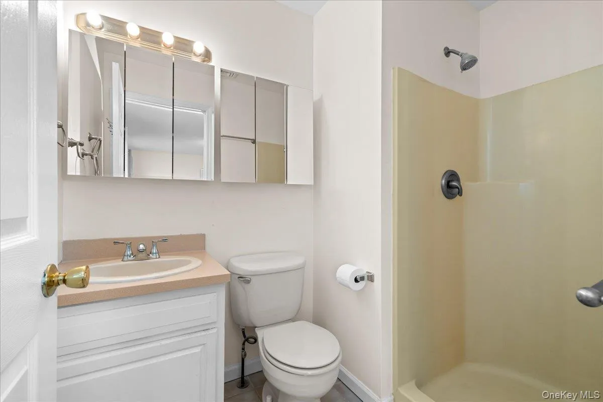 This has a walk-in shower. This has a walk-in shower.