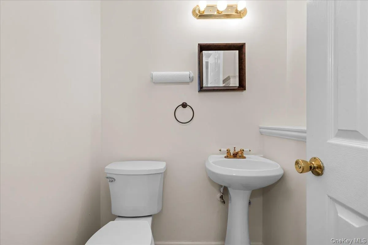 The half bathroom on the lower level is quite the convenience. The half bathroom on the lower level is quite the convenience.
