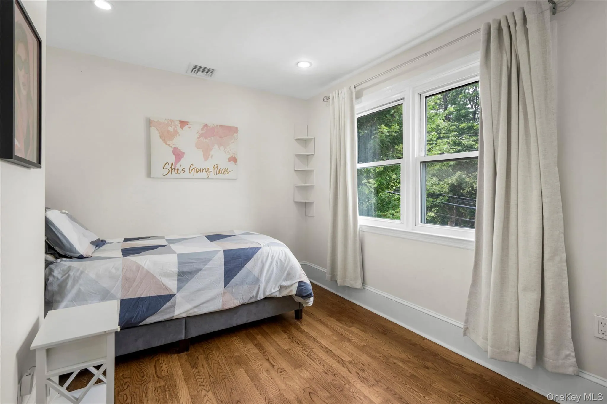 Bright bedroom with a walk-in closet. Bright bedroom with a walk-in closet.