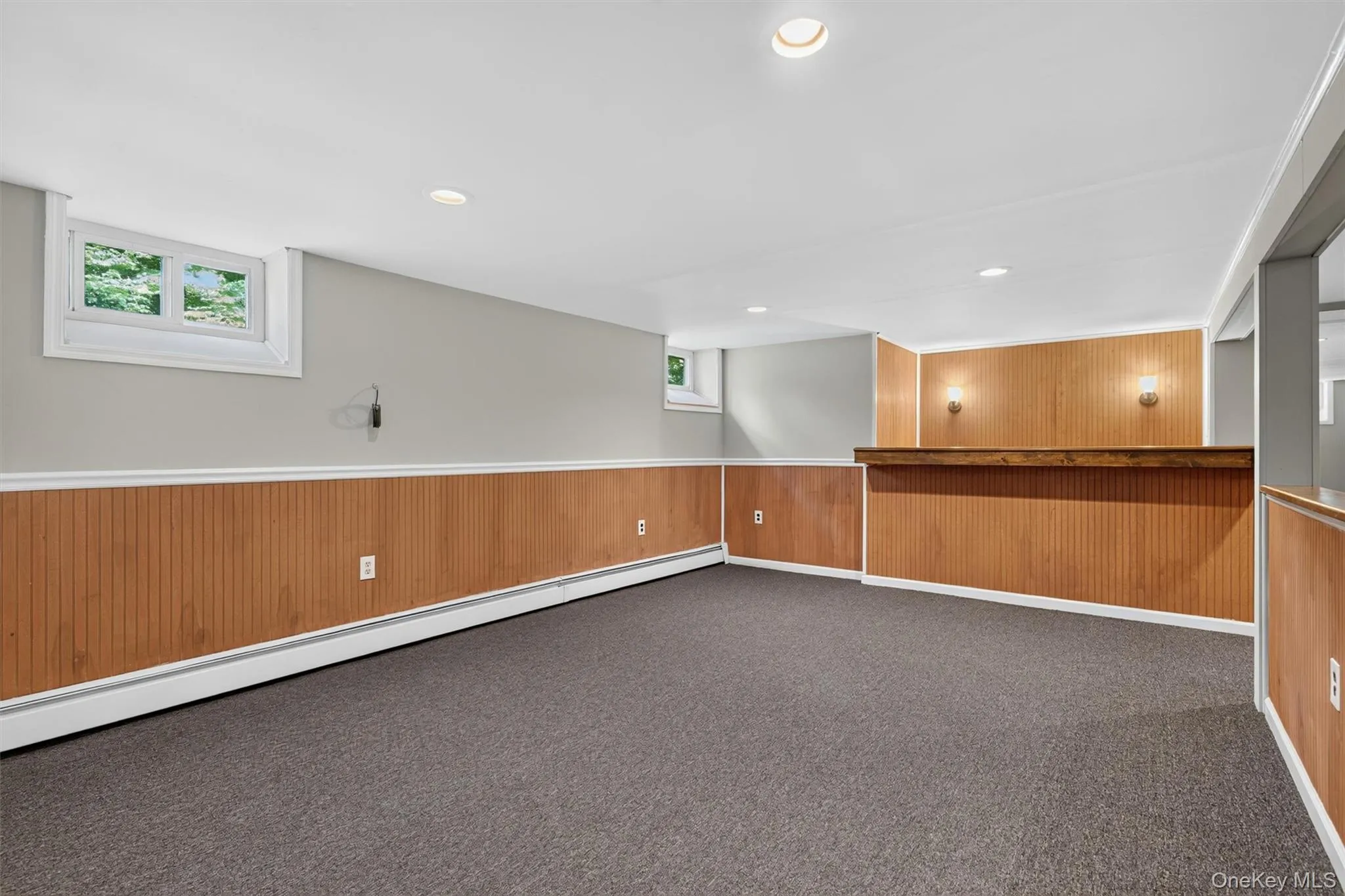 Finished basement with multiple closets and a full bar with water hookup for a wet bar Finished basement with multiple closets and a full bar with water hookup for a wet bar