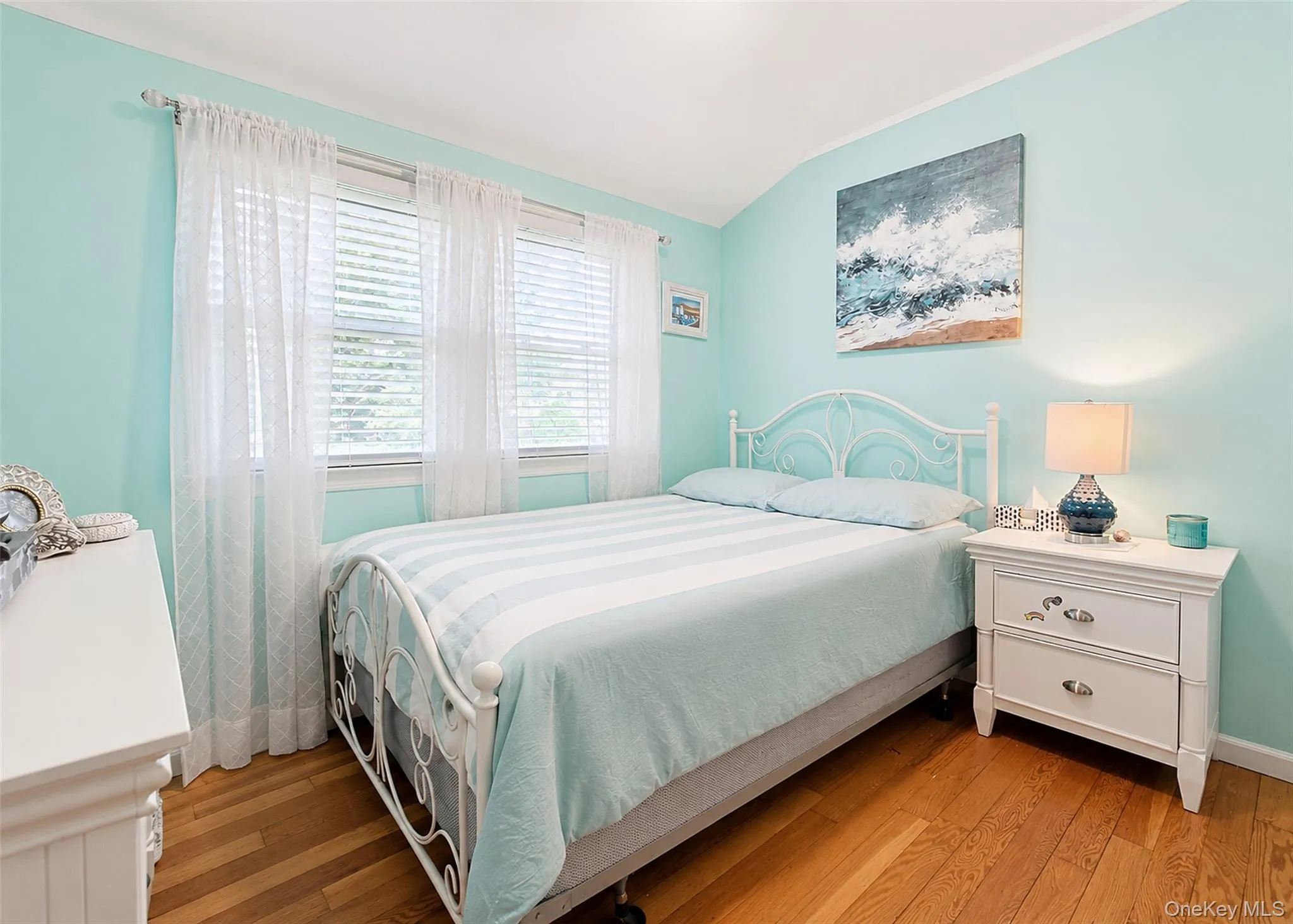 Bedroom With Hardwood Flooring & Ample Closet Space. Bedroom With Hardwood Flooring & Ample Closet Space.