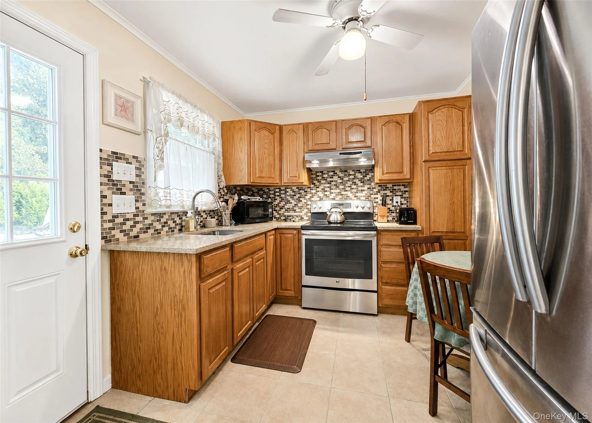 Updated Kitchen With Granite Counters & Deco Tile Backsplash. Updated Kitchen With Granite Counters & Deco Tile Backsplash.