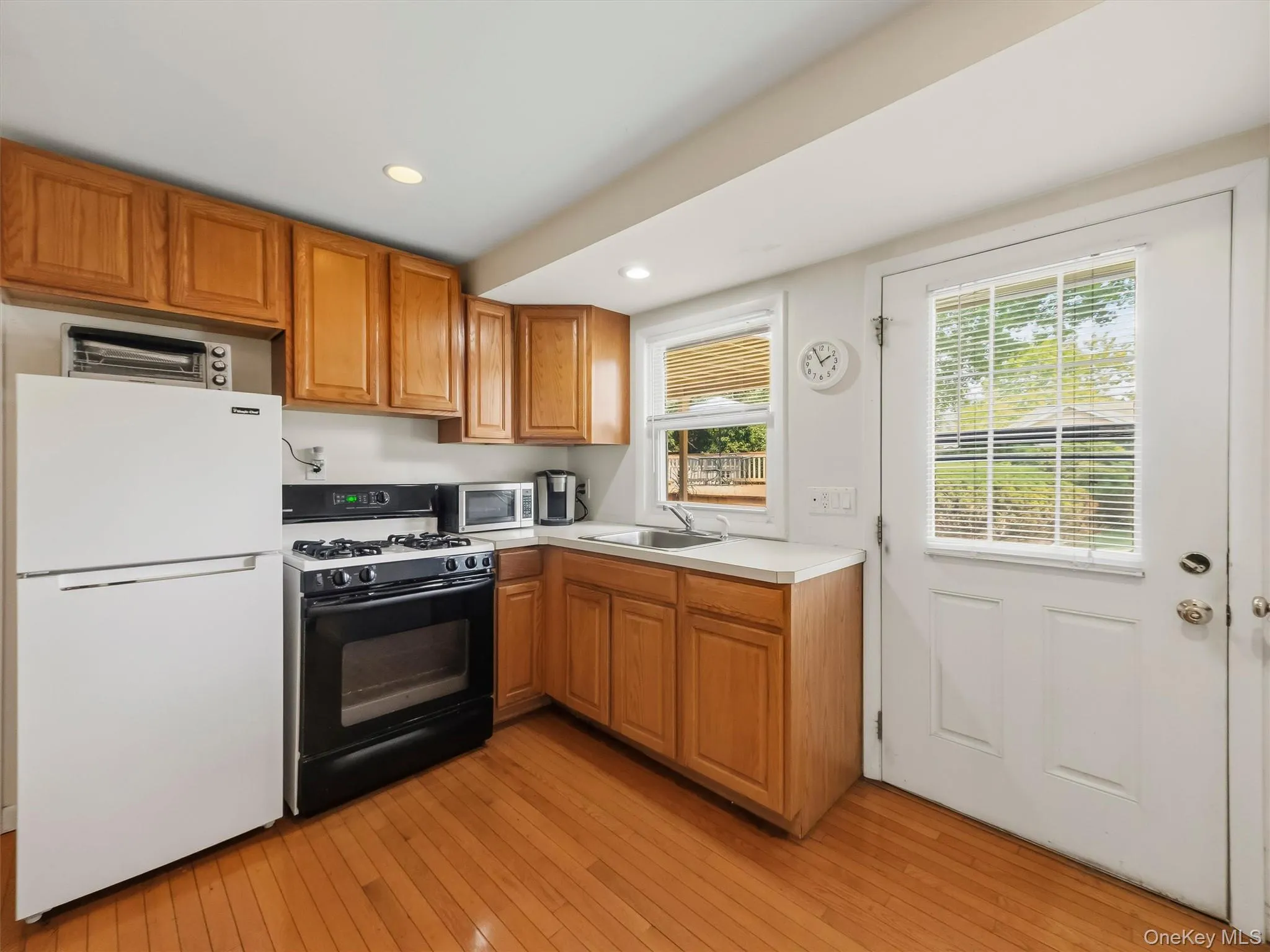 Kitchen featuring Oven/Stove, Refrigerator, recessed lighting, ample cabinetry, and plenty of countertop space. Kitchen featuring Oven/Stove, Refrigerator, recessed lighting, ample cabinetry, and plenty of countertop space.