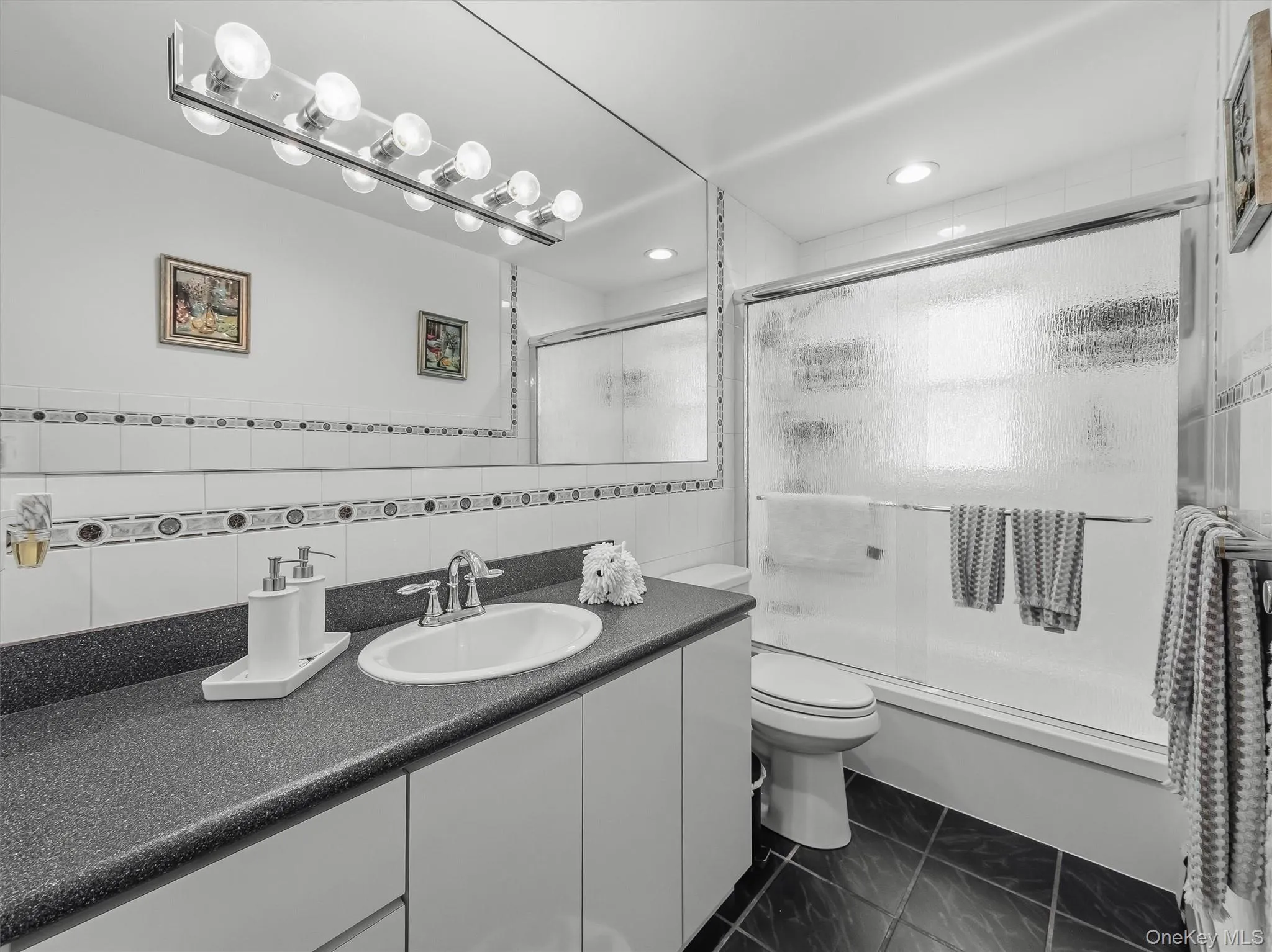 A beautifully updated full hallway bathroom. A beautifully updated full hallway bathroom.