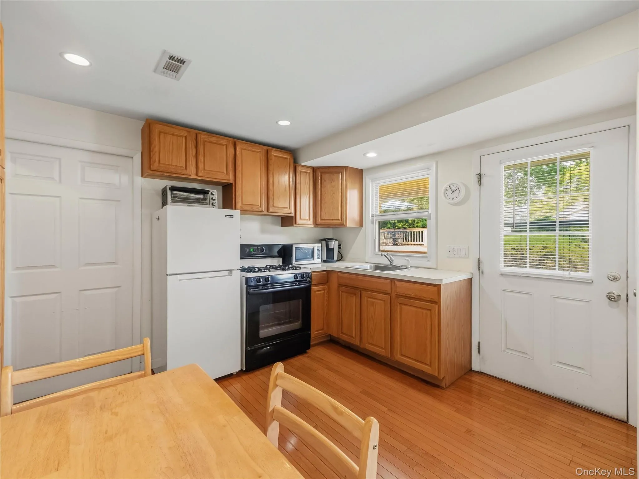 Kitchen featuring Oven/Stove, Refrigerator, recessed lighting, ample cabinetry, and plenty of countertop space. Kitchen featuring Oven/Stove, Refrigerator, recessed lighting, ample cabinetry, and plenty of countertop space.