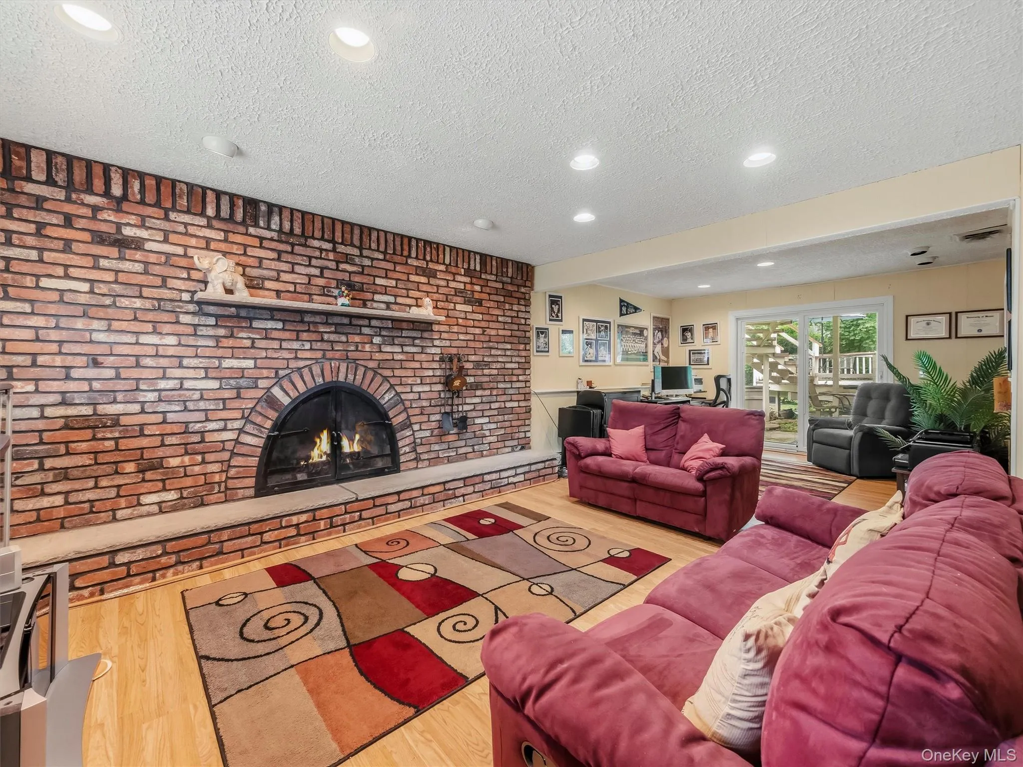 The family room downstairs is awesome for entertaining and relaxing. Please note that the fireplace is decorative and non-connected. Picture was edited to show how it could look. The family room downstairs is awesome for entertaining and relaxing. Please note that the fireplace is decorative and non-connected. Picture was edited to show how it could look.