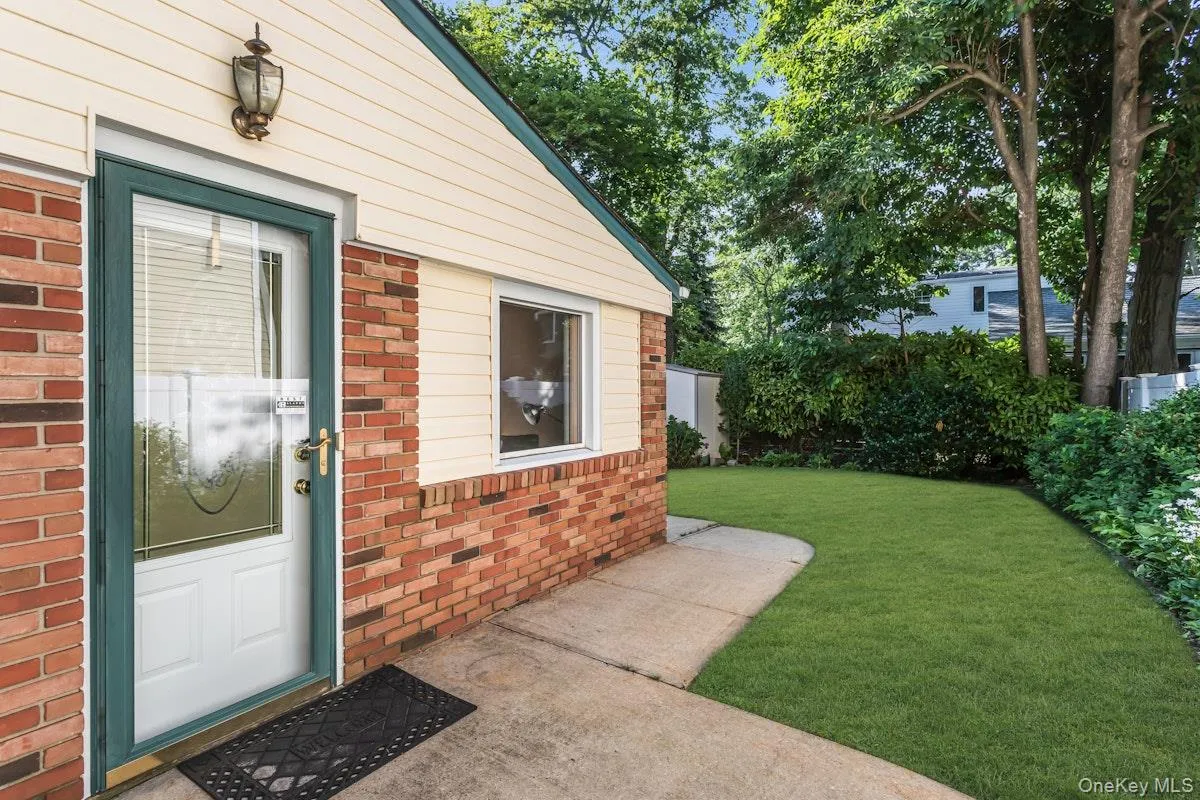 Door from Den out to Side Yard Door from Den out to Side Yard