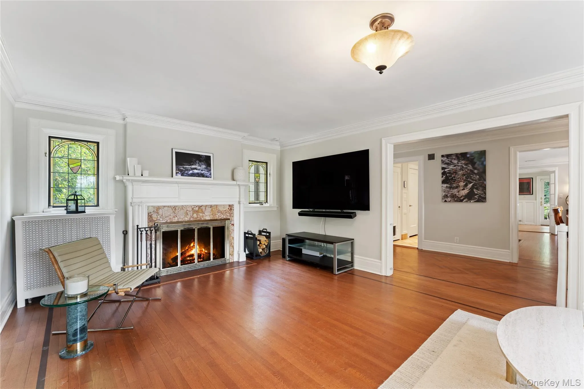 Living Room featuring fireplace and stained glass windows. Living Room featuring fireplace and stained glass windows.