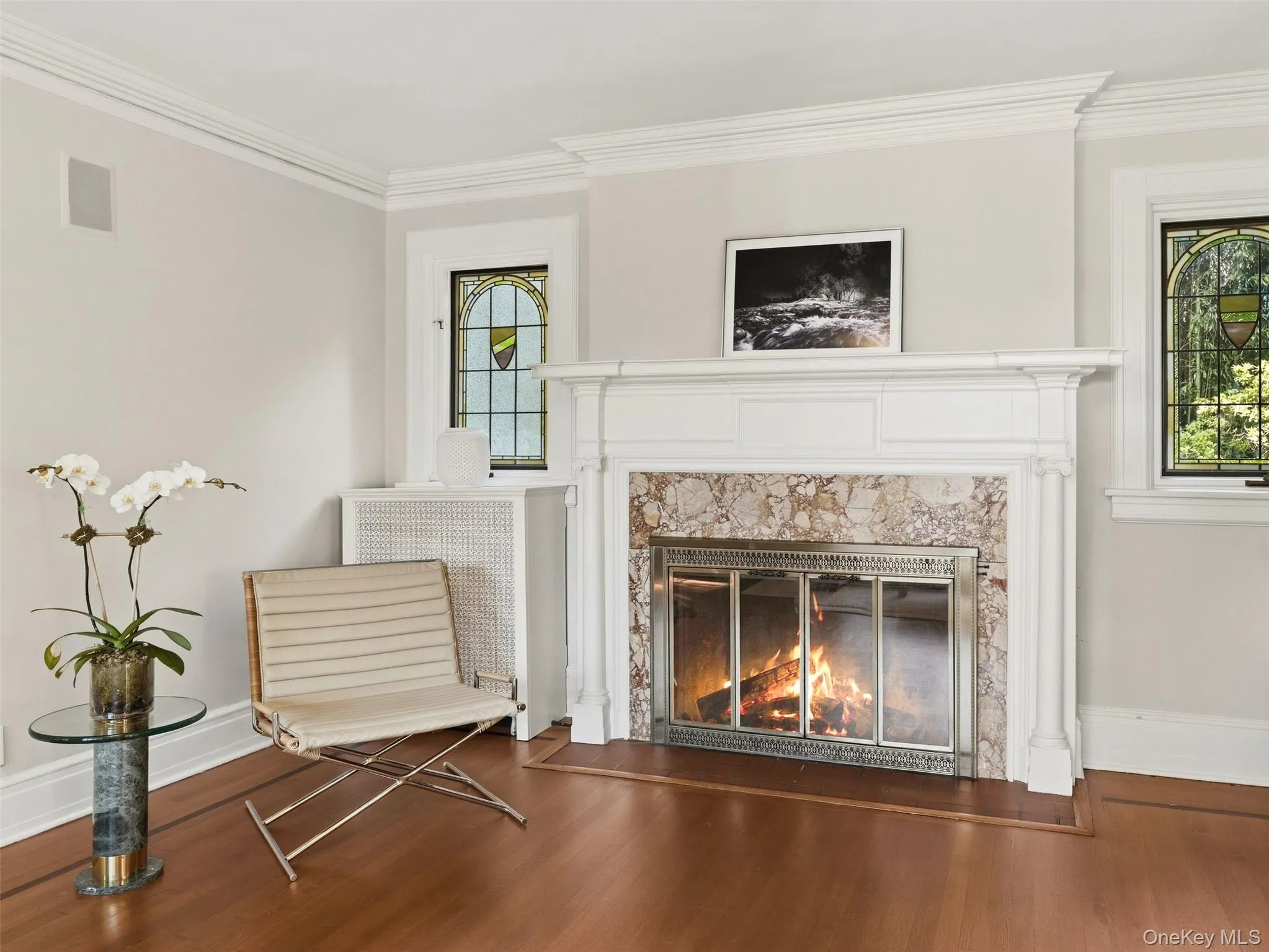 Living Room featuring stained-glass windows. Living Room featuring stained-glass windows.
